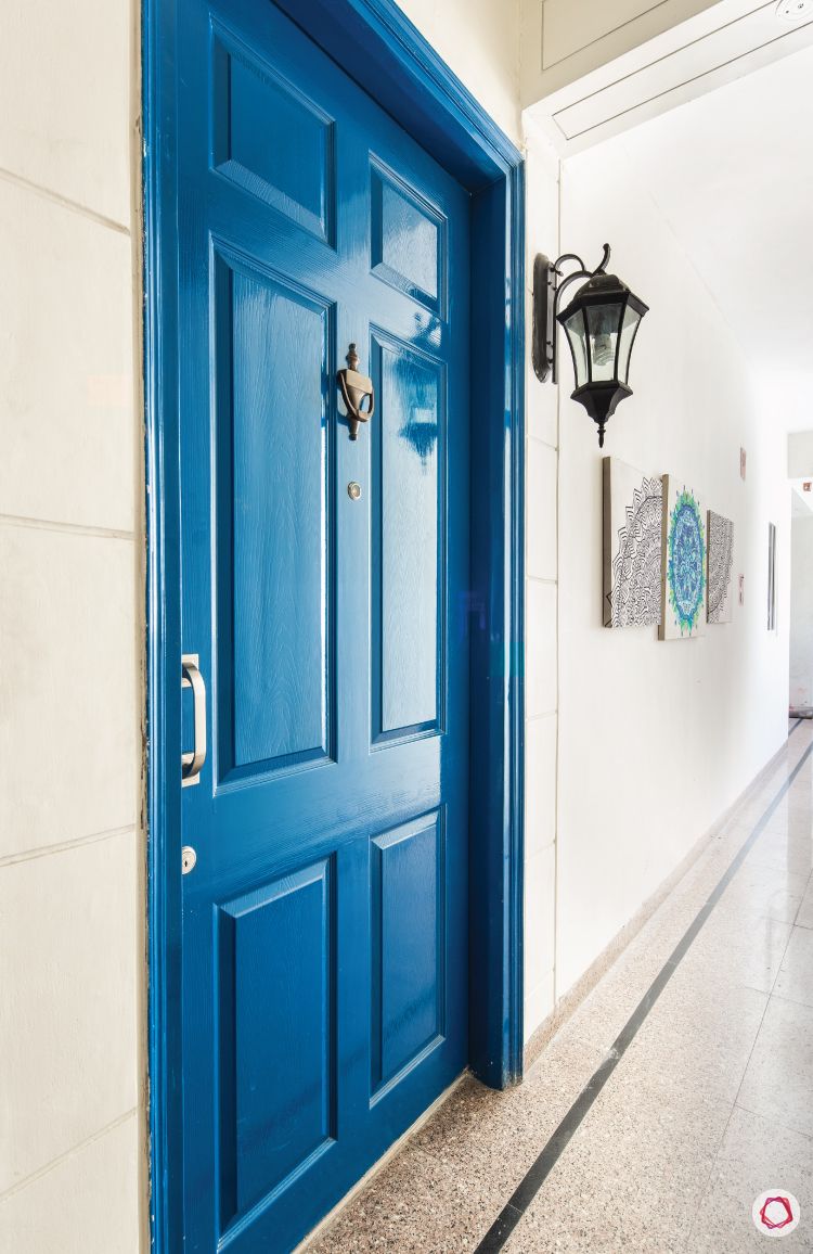 flat-in-faridabad-entrance-passage-royal-blue-door-english-lamp-tile-flooring
