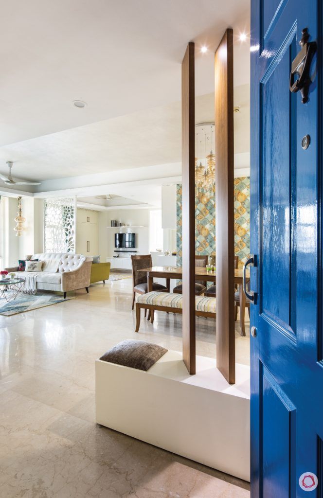 flat-in-faridabad-entrance-blue-door-living-wooden-rafters-shoe-rack-sofa
