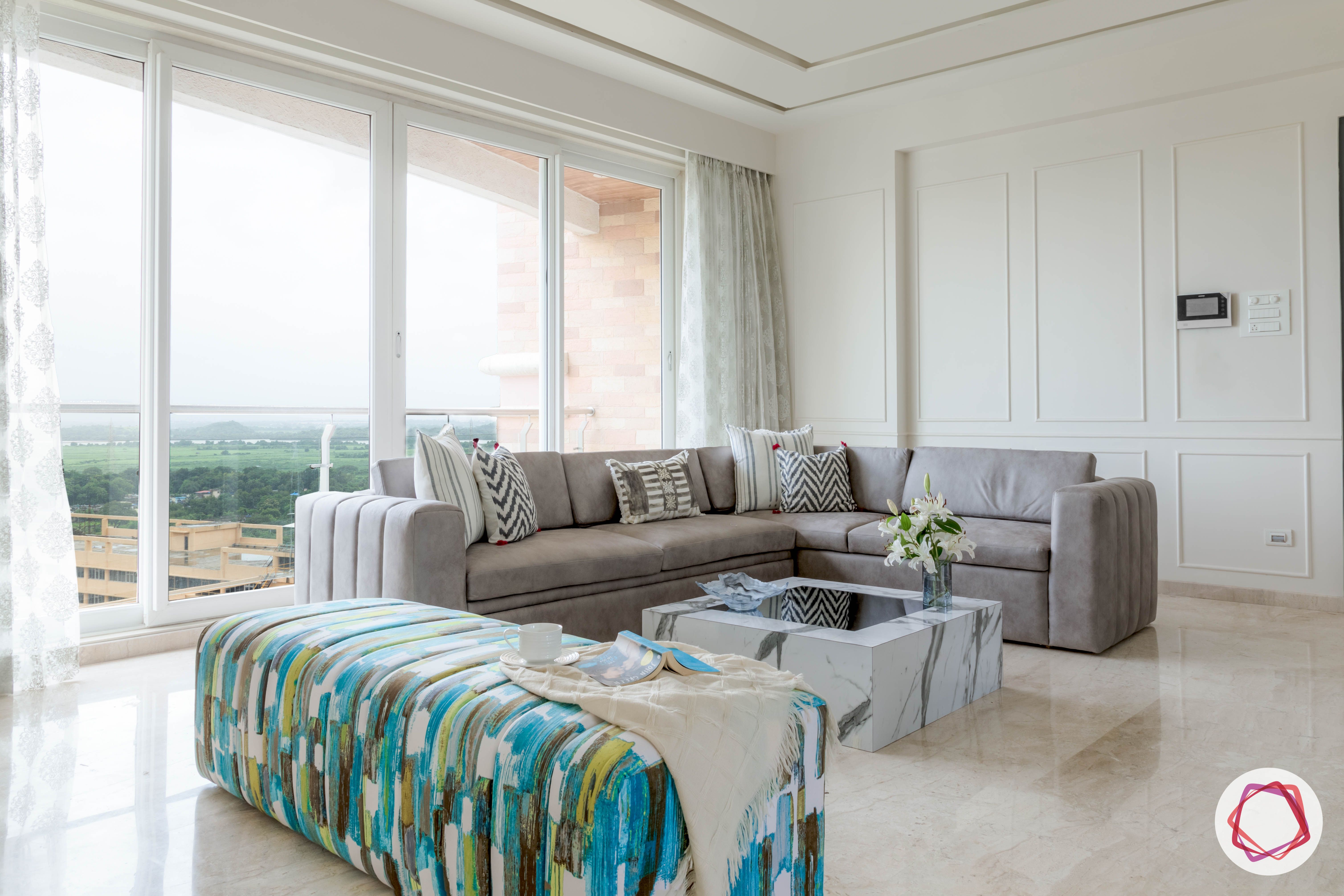 interior-design-questions-grey-sofa-marble-coffee-table-white-walls-balcony
