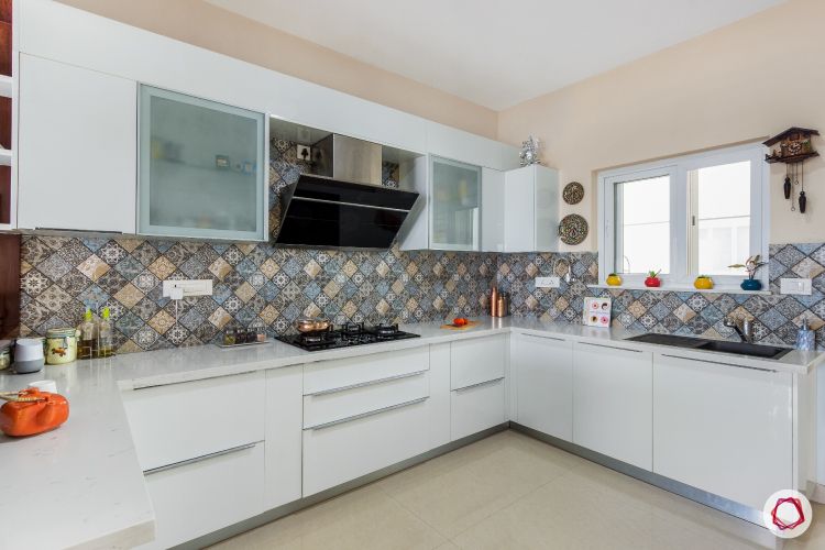 white kitchen-moroccan tiles-ducted chimney
