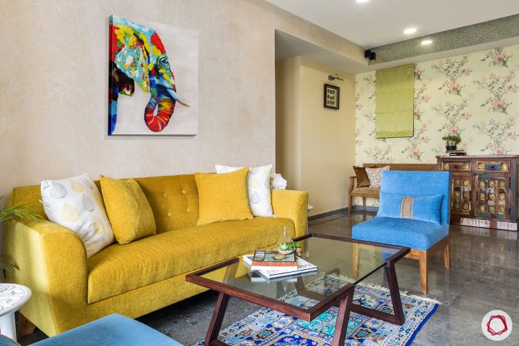 living-room-dining-sofa-yellow-blue-chair-wall-art-table
