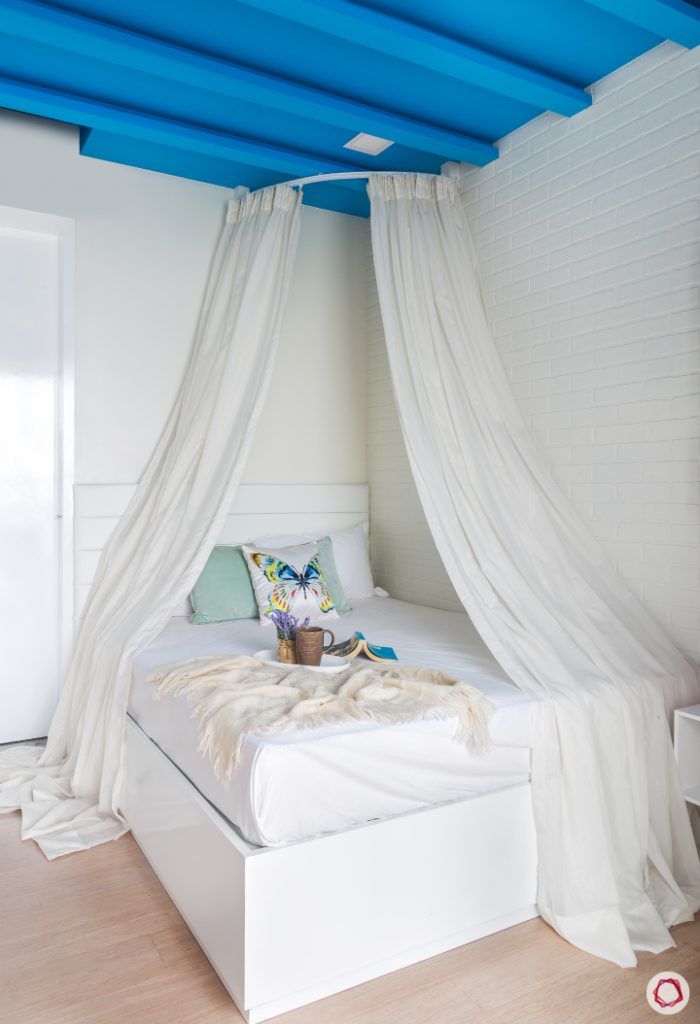 daughter-bedroom-white-bed-drapes-blue-rafters