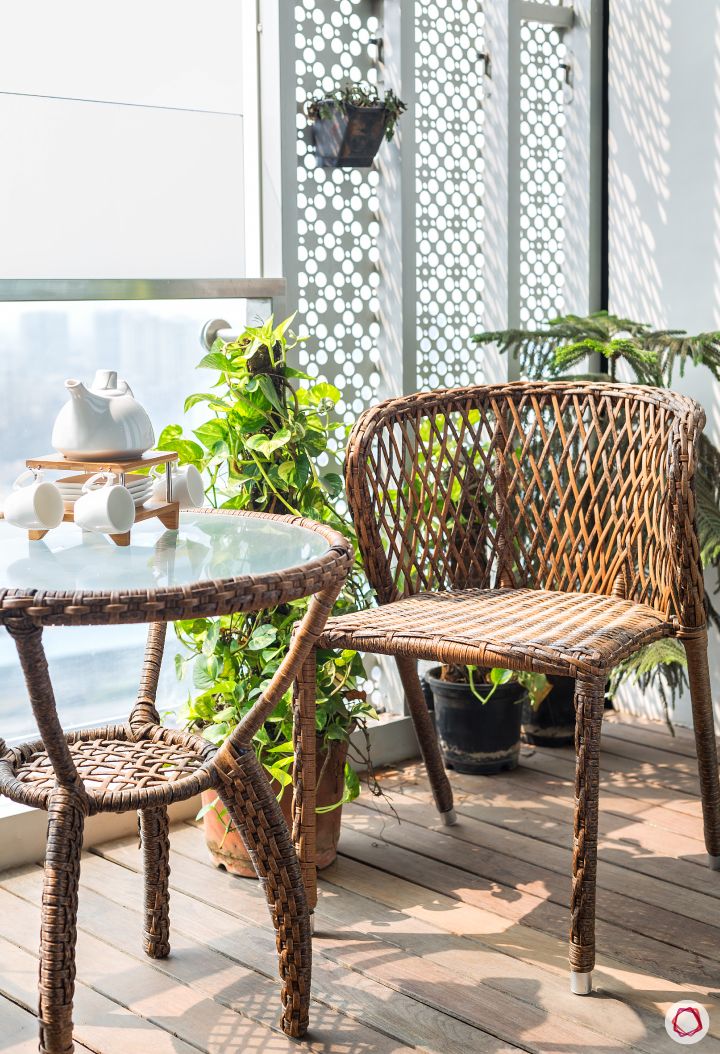 lodha-wadala-balcony-chair-table-plants-white-divider-flooring
