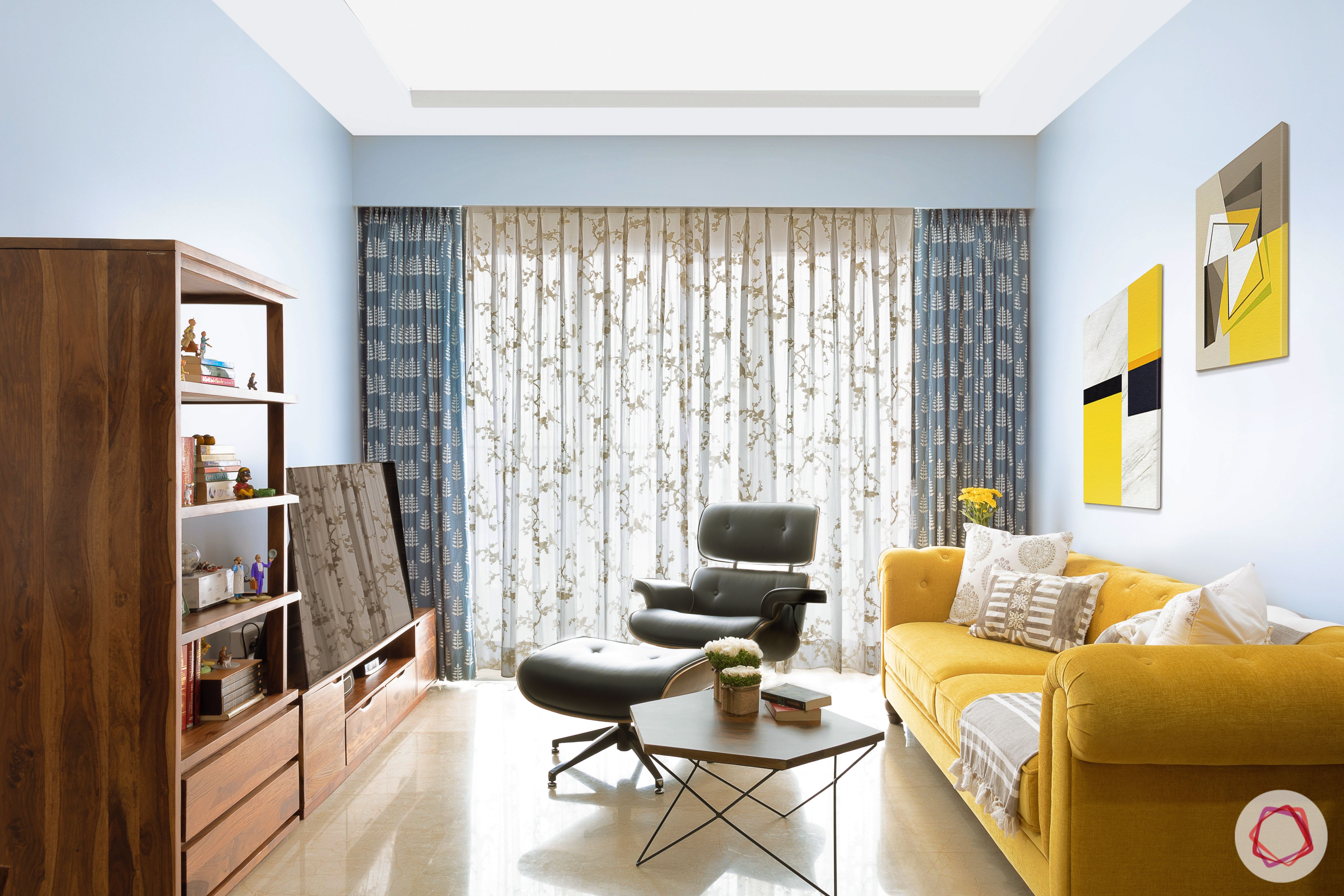 crescent bay-living room-yellow sofa-wooden tv unit-drapes-curtains