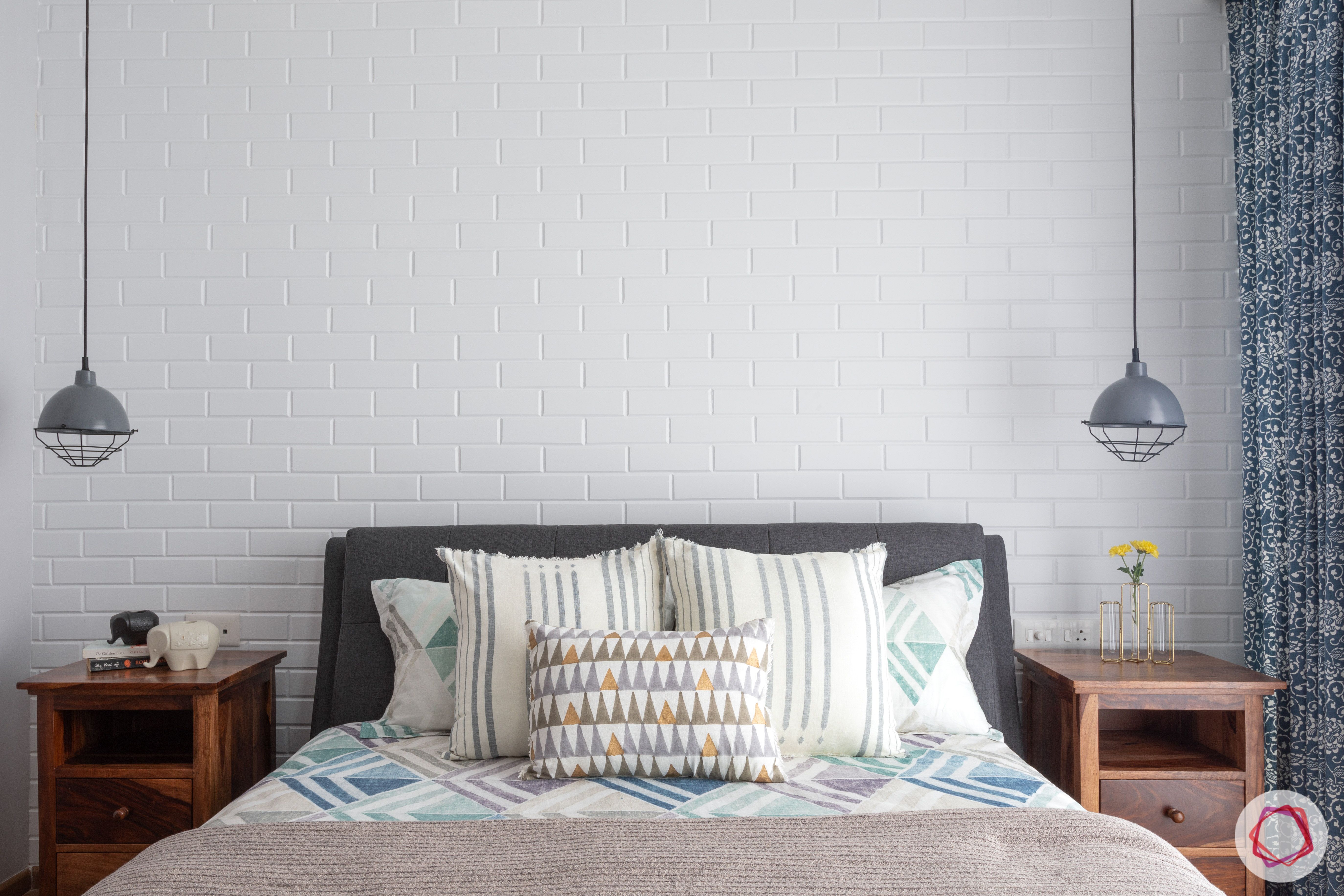 crescent bay-master bedroom-bed-exposed brick wall-pendant lights-grey and white room