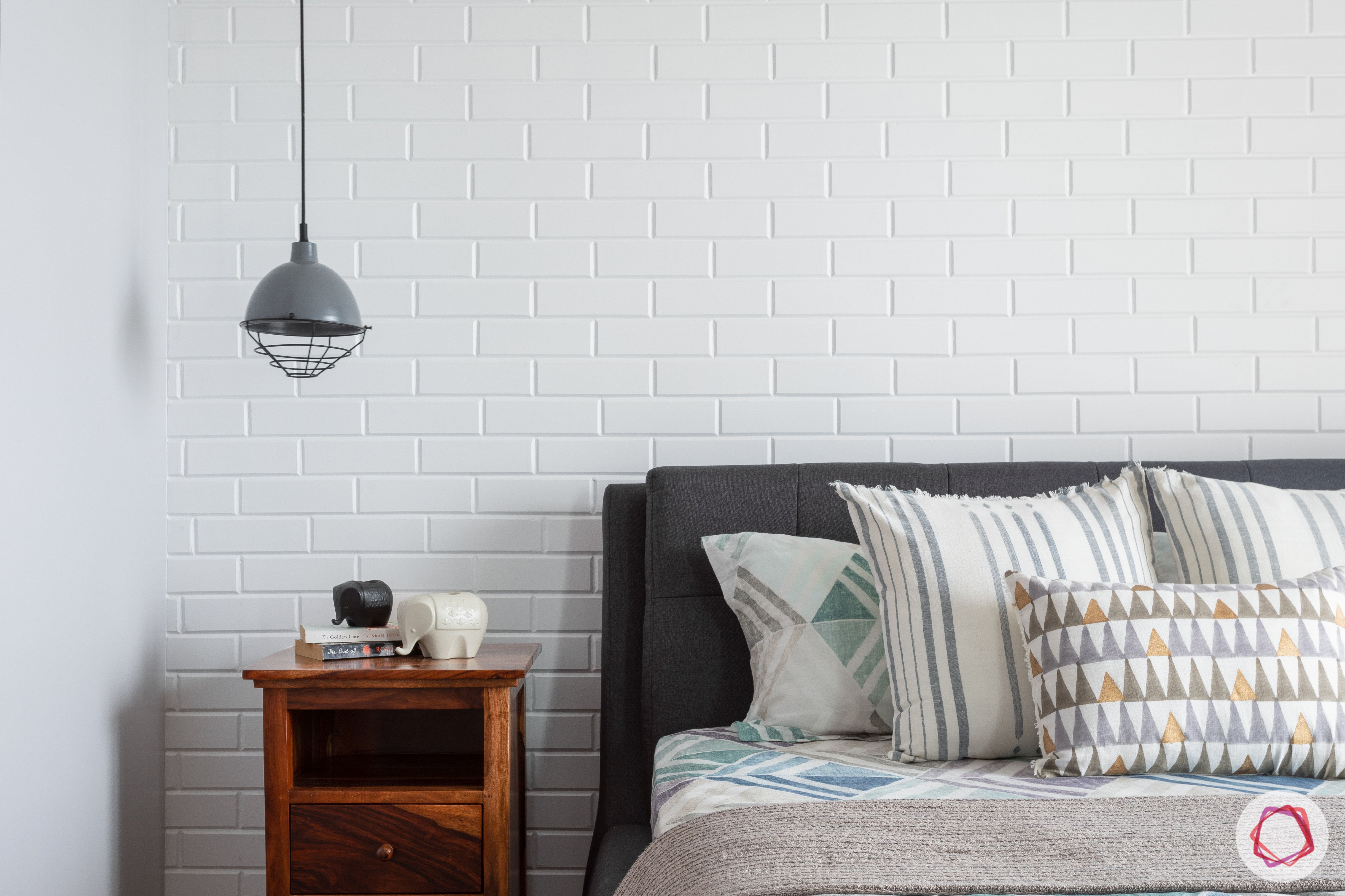 crescent bay-master bedroom-wooden side table-mesh pendant light-exposed brick wall