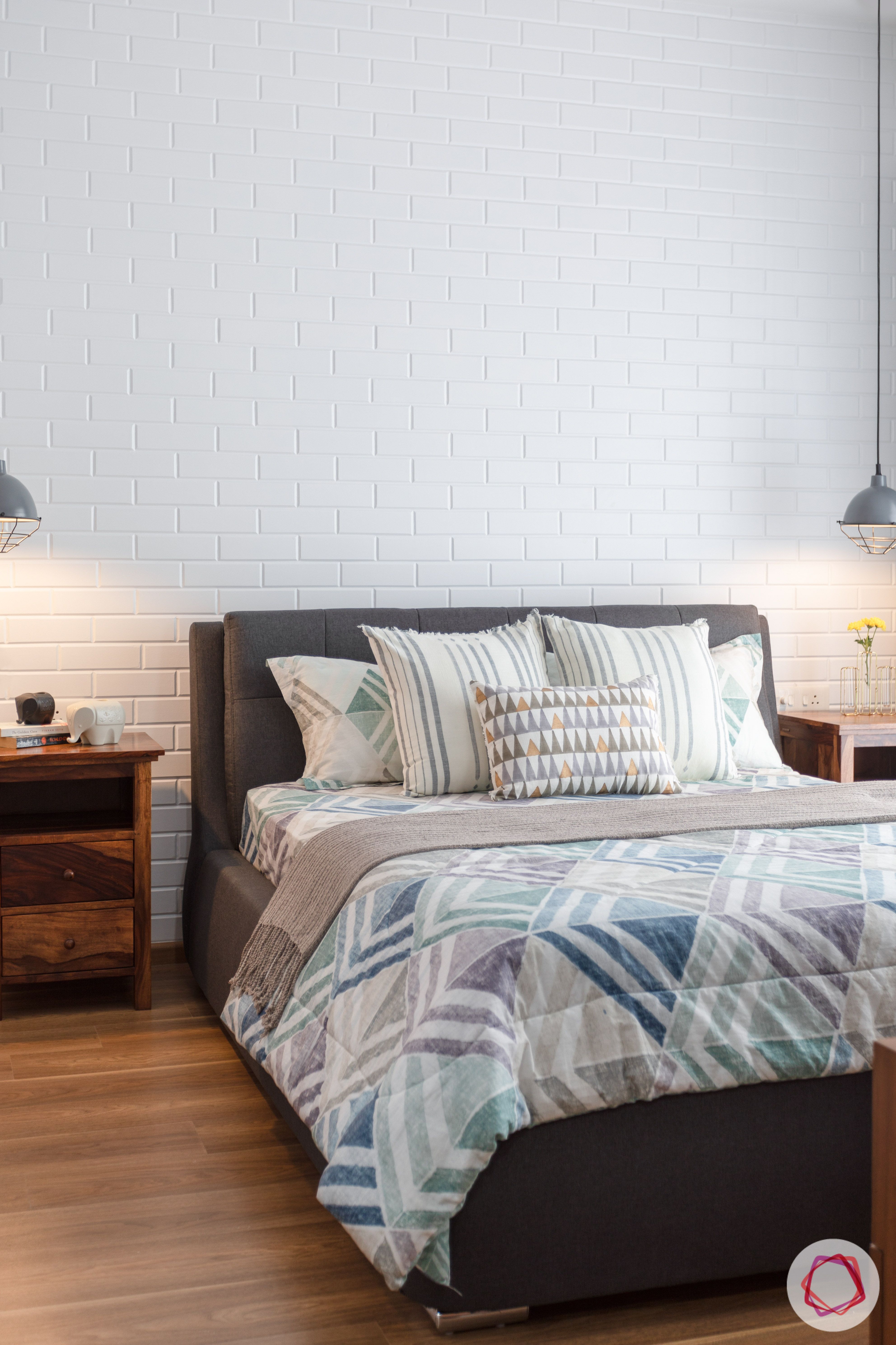 crescent bay-master bedroom-pendant lights-wooden flooring-exposed brick wall