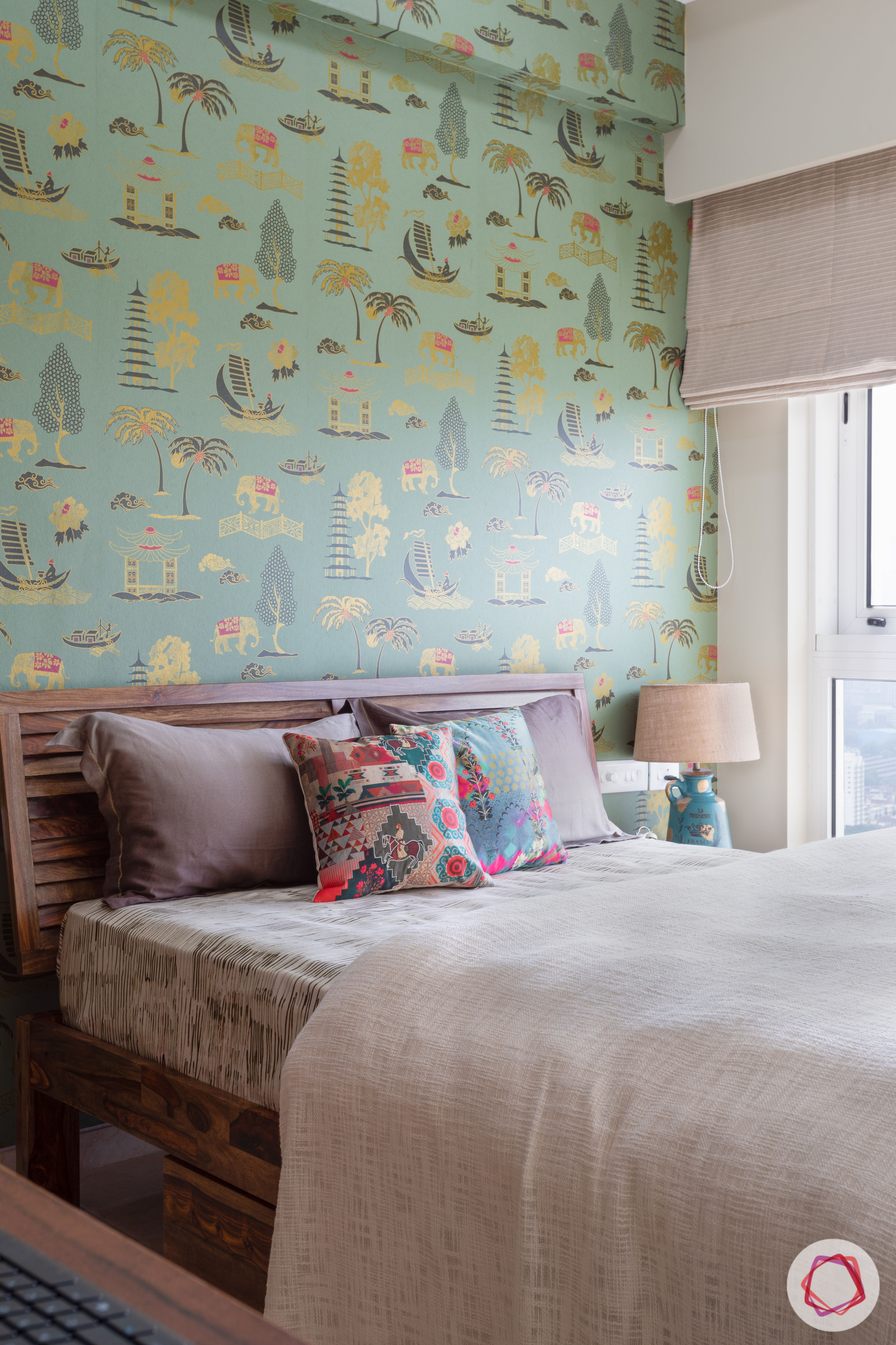 crescent bay-guest bedroom-green wallpaper-wooden bed-bedside lamp