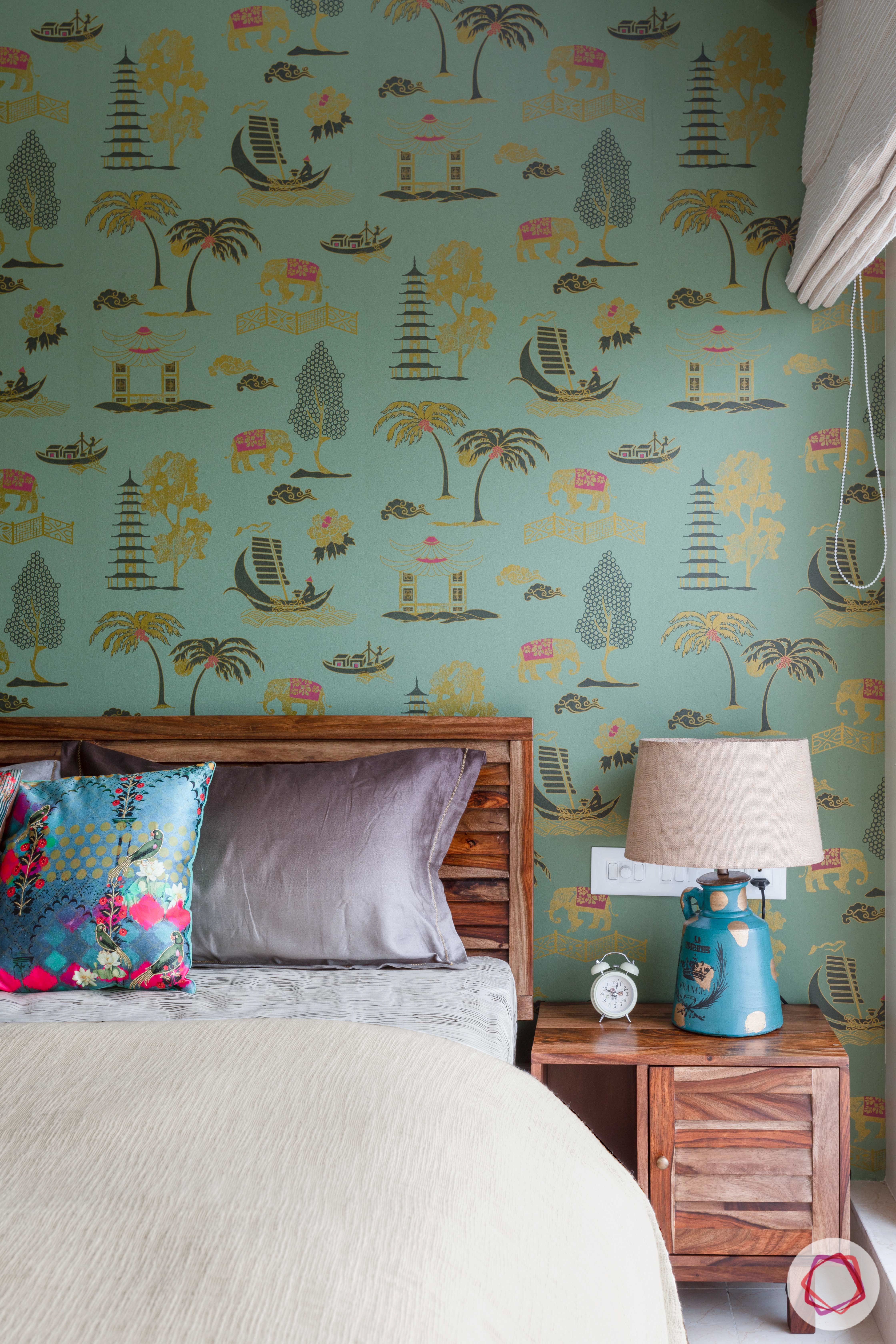 crescent bay-guest bedroom-green wallpaper-wooden bed-bedside lamp-printed wallpaper
