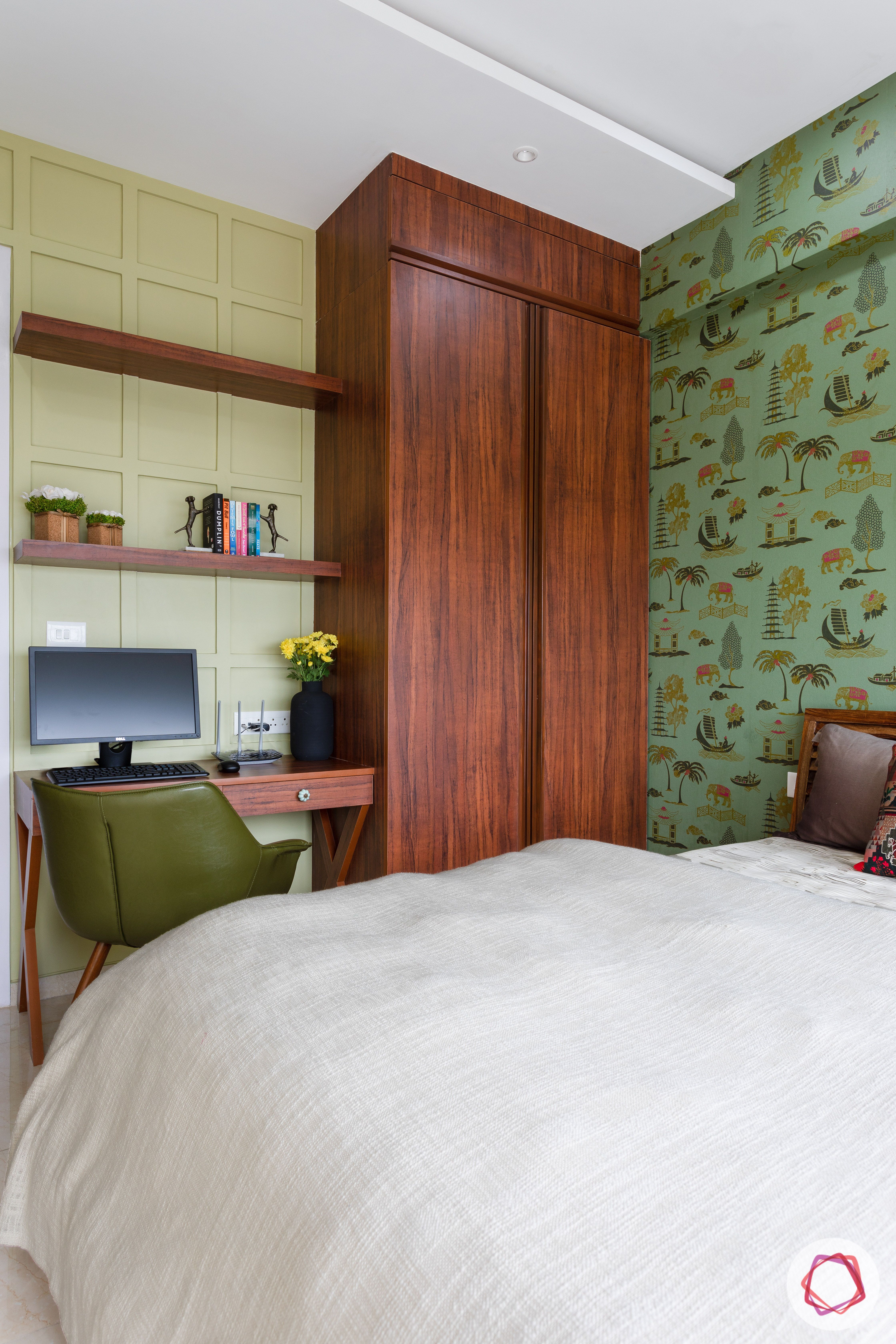 crescent bay-guest bedroom-green wallpaper-study table-wall mouldings-wooden shelves