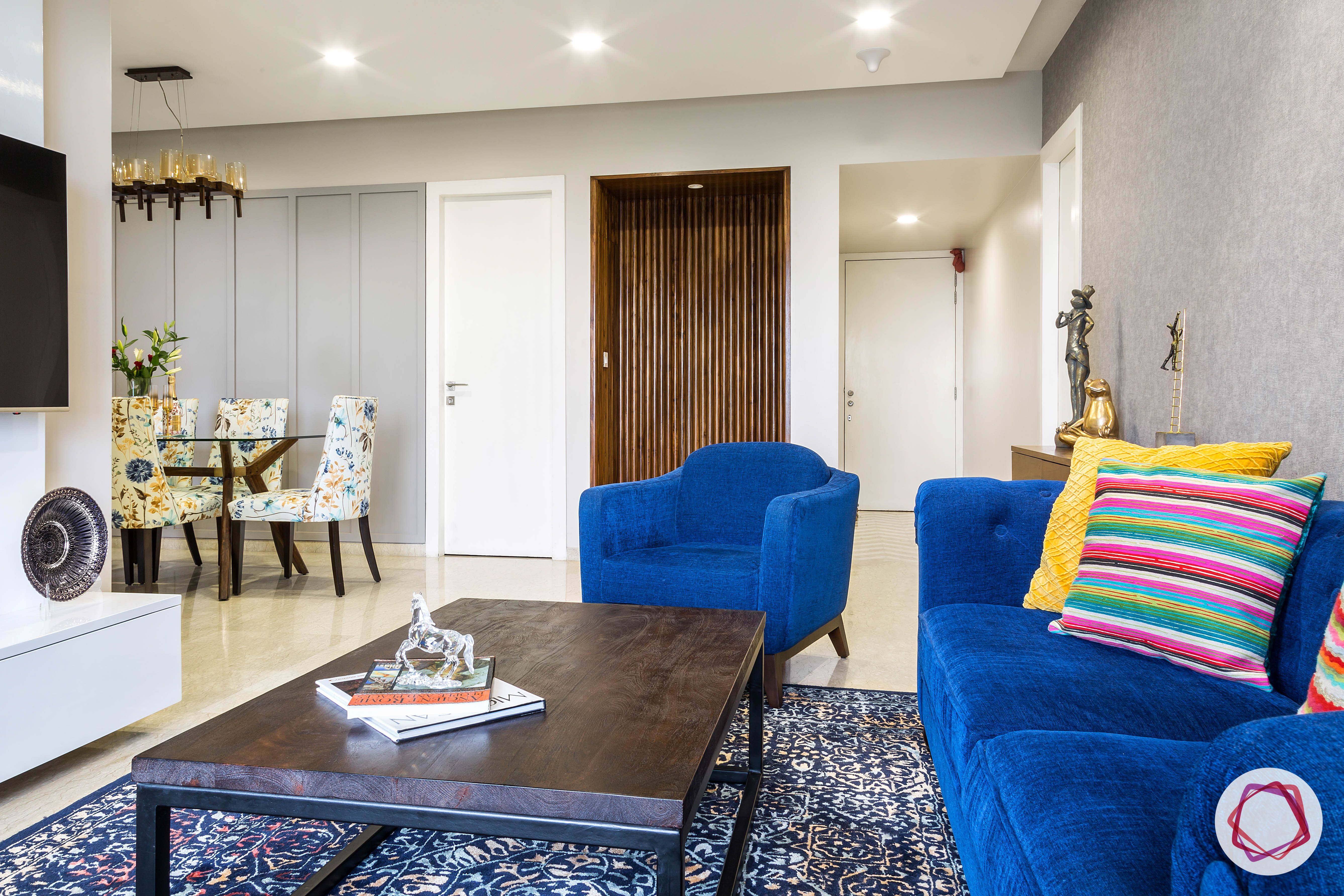 lodha group-living room designs-blue sofa designs-persian rug designs-veneer centre table