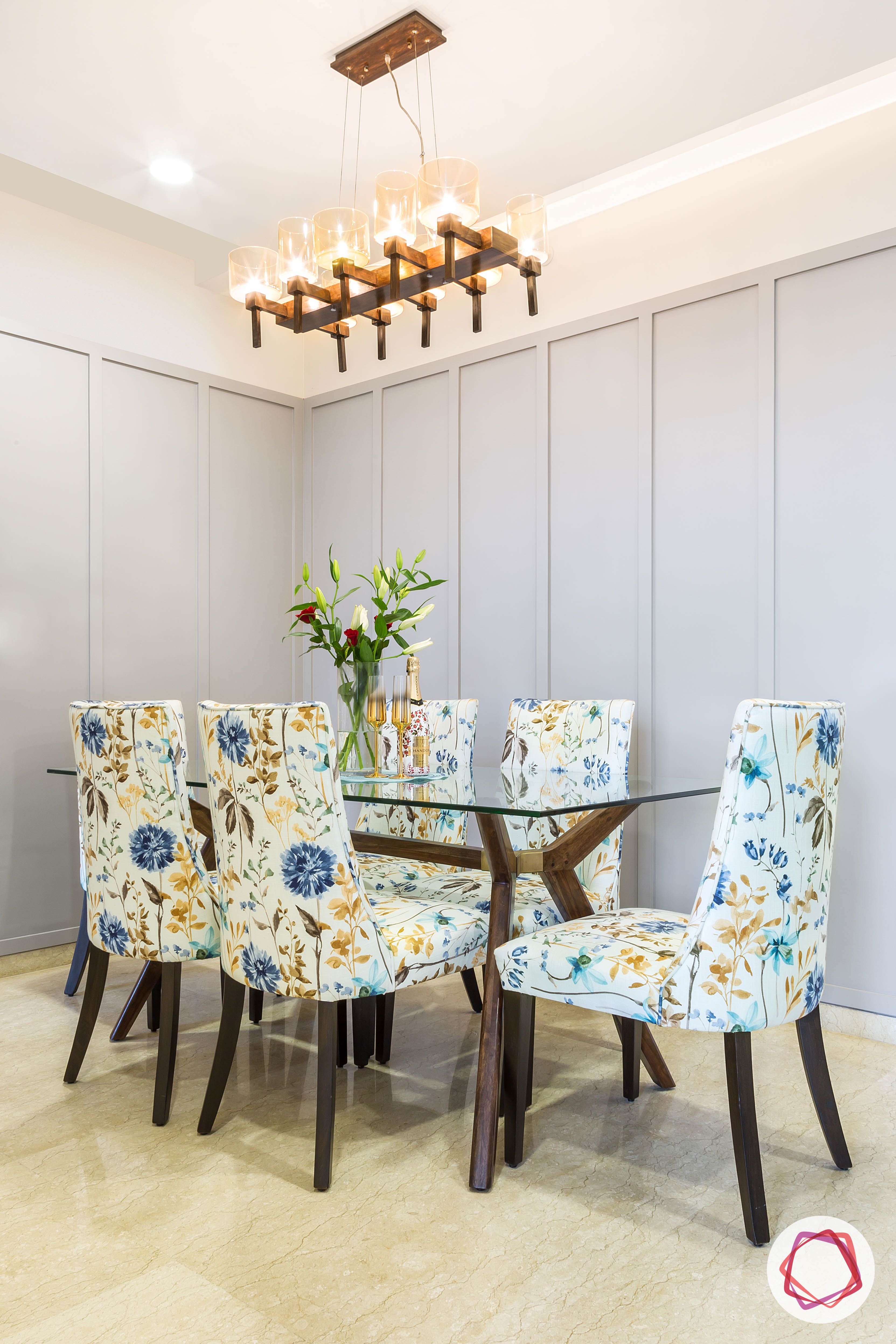  lodha group-dining room designs-glass dining table-floral dining chair designs