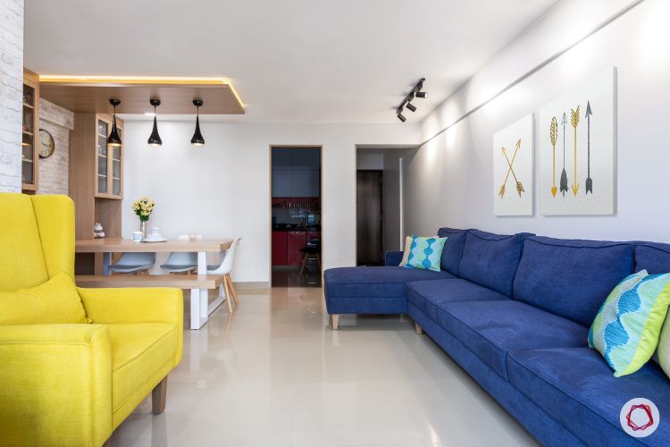 godrej homes-mumbai home-living room-white wall-track lights-blue sofa-led strip light