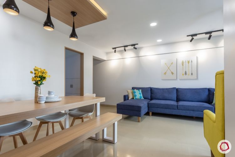 godrej homes-mumbai home-dining room-LED strip light-wooden dining table-pendant lights-bench