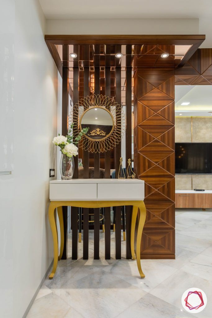 residential-interior-designers-in-mumbai-foyer-wood-gold-console-table
