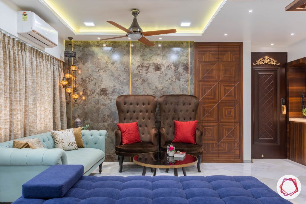 residential-interior-designers-in-mumbai-living-room-sofa-brown-blue-tiles
