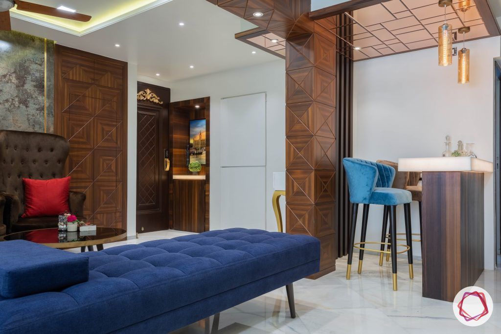 residential-interior-designers-in-mumbai-bar-blue-stool-mirror-light-table
