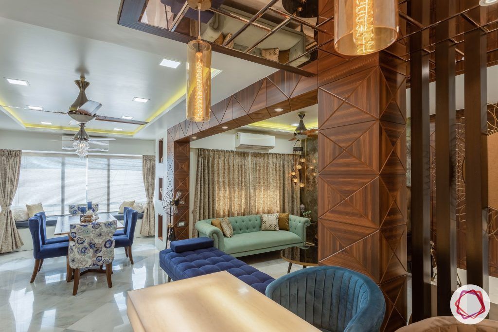 residential-interior-designers-in-mumbai-bar-dining-chairs-wooden-wall-table
