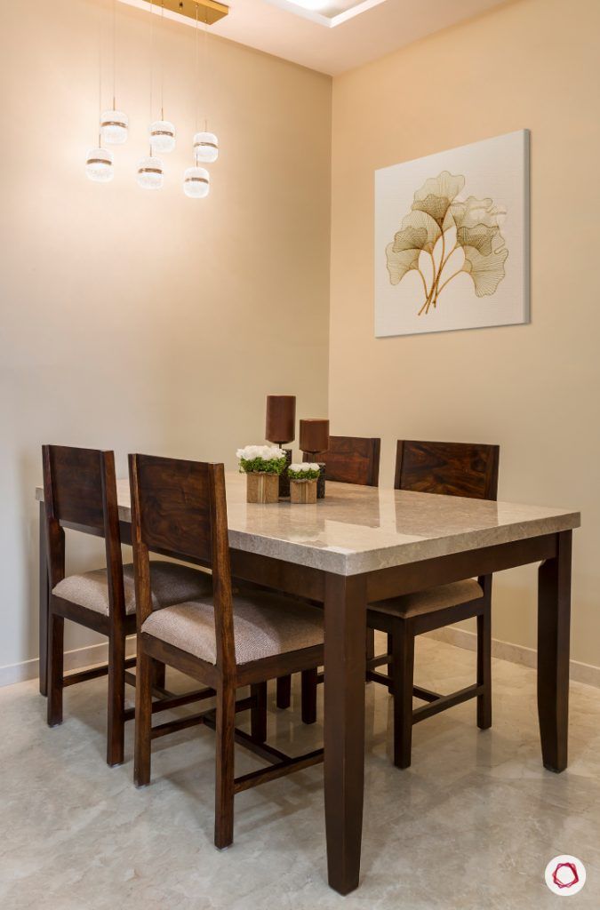 best interior designers in mumbai-dining room-marble top table-wooden chairs