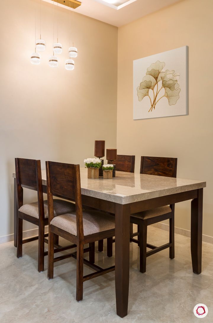 best interior designers in mumbai-dining room-marble top table-wooden chairs