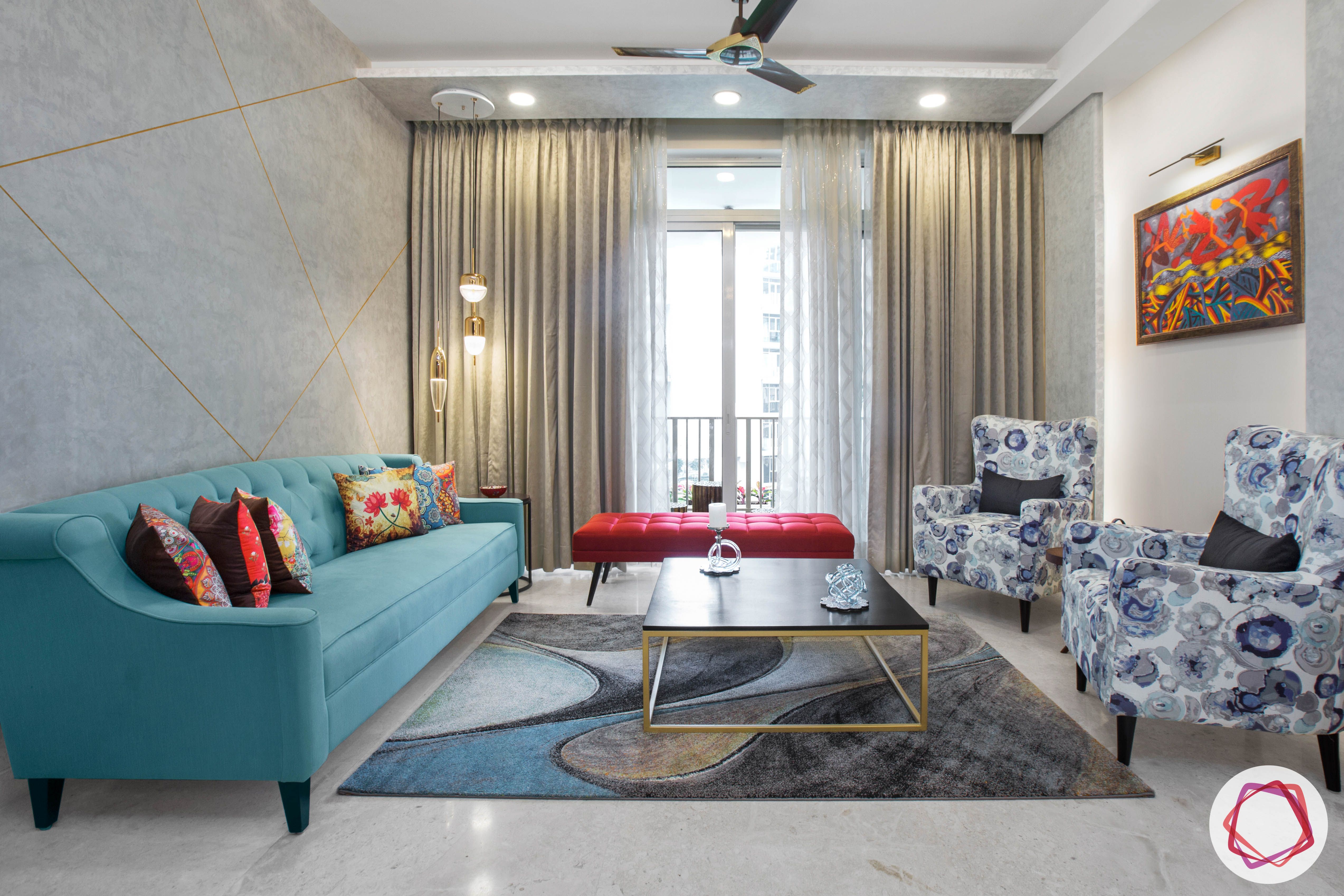 best-interior-designers-in-gurgaon-armchair-designs-blue-sofa-designs-red-ottoman-designs