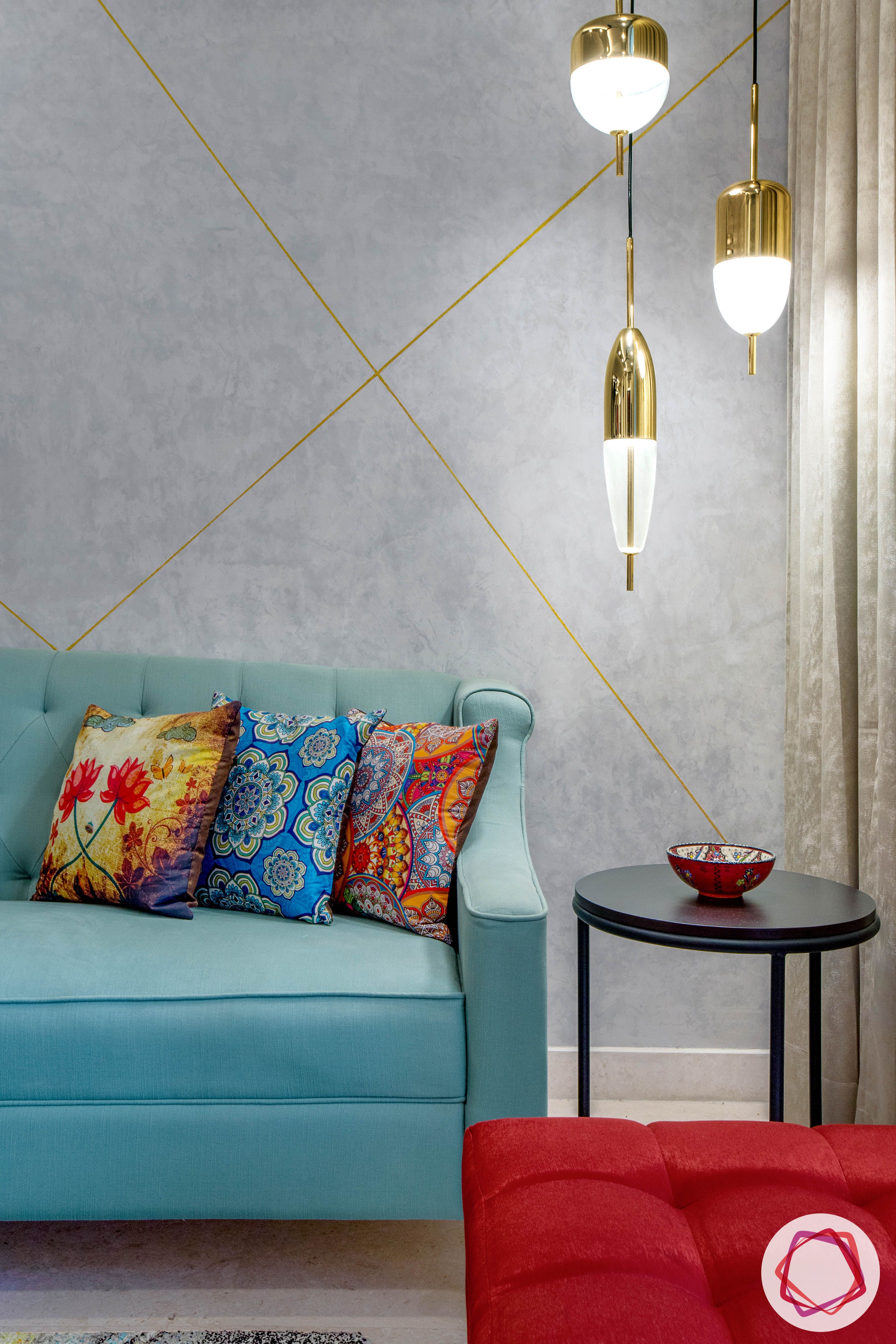 best-interior-designers-in-gurgaon-blue-sofa-designs-round-side-table-designs-pendant-light-for-corner
