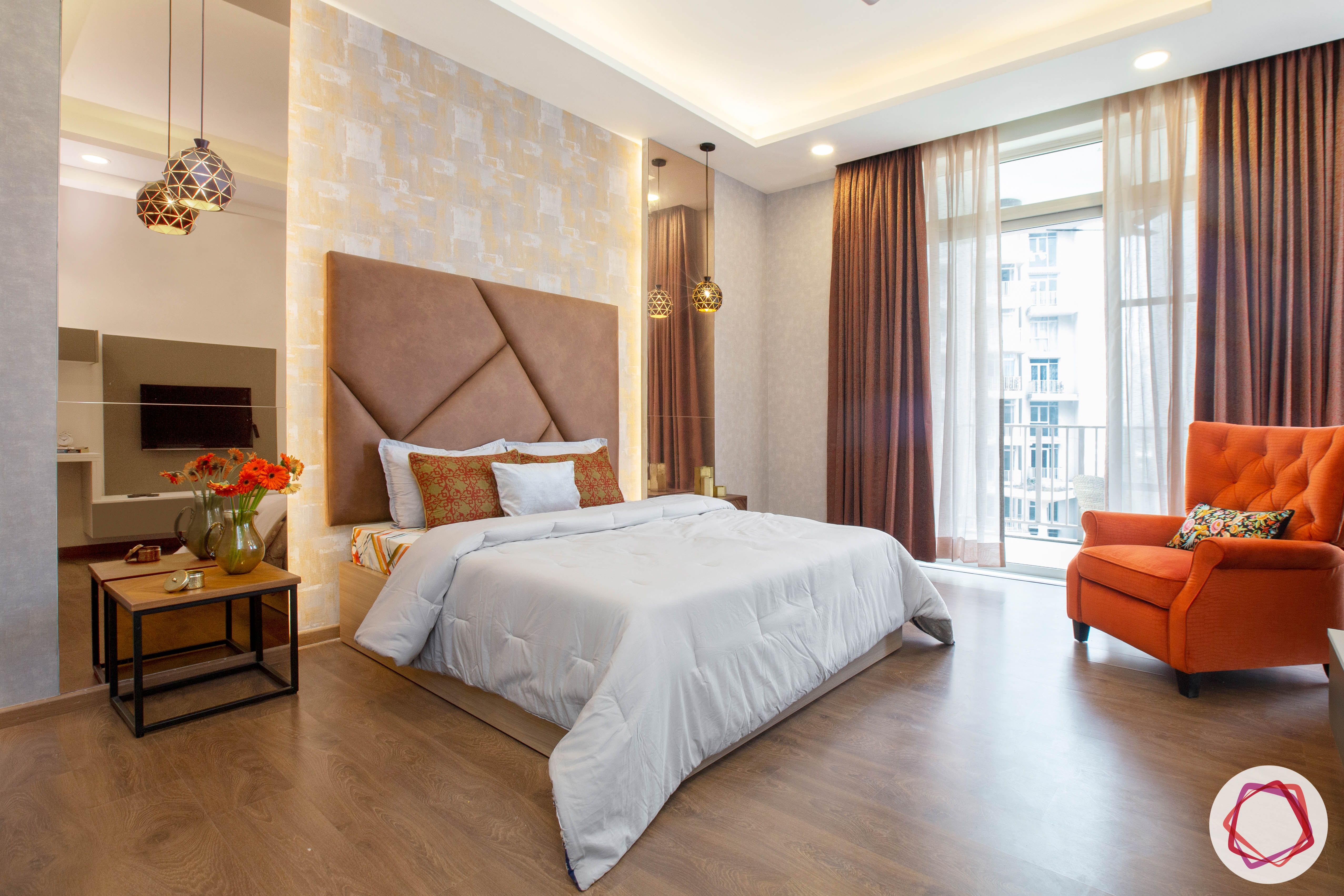 best-interior-designers-in-gurgaon-contemporary-bedroom-designs-orange-armchair-designs-tinted-mirror-panels