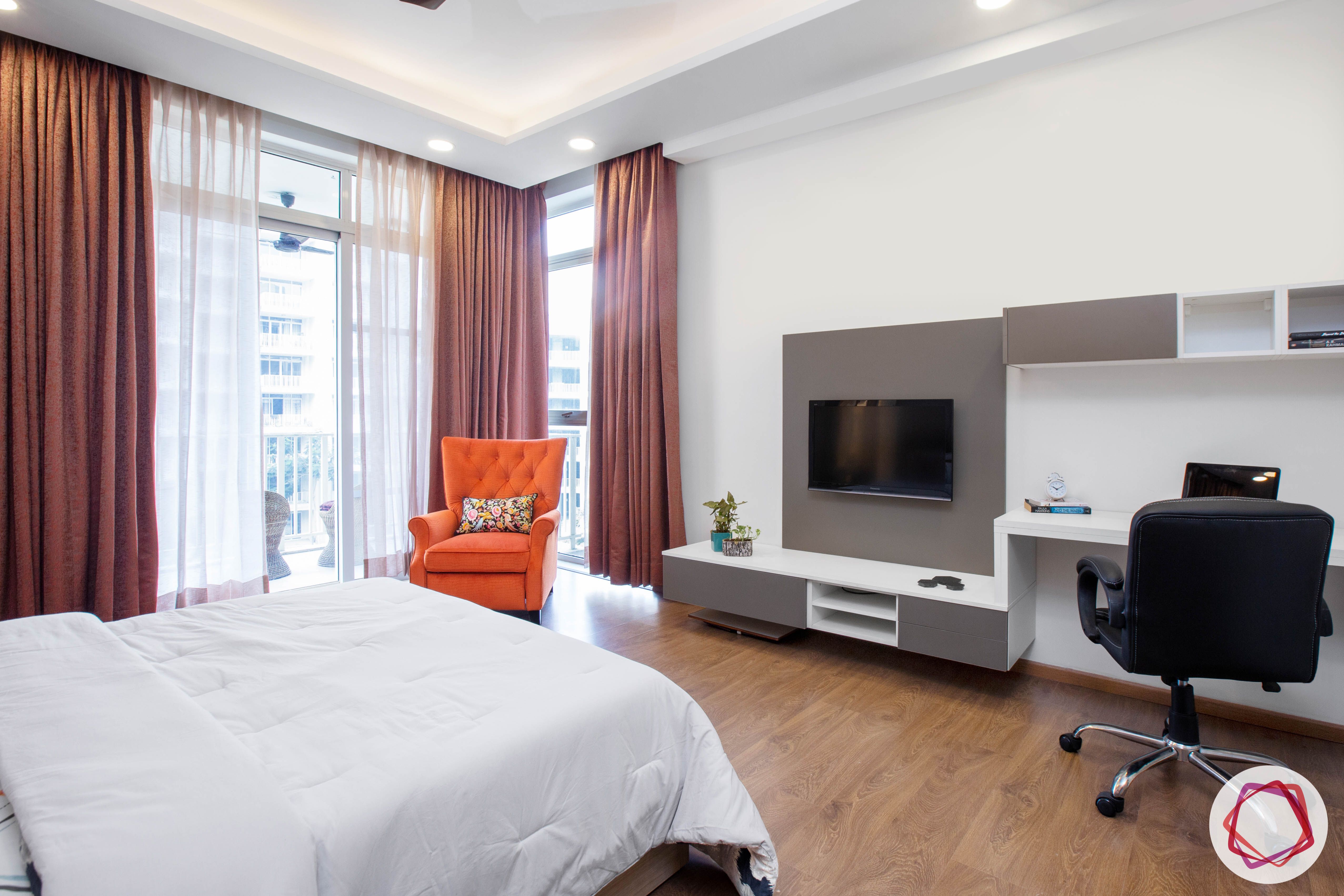 best-interior-designers-in-gurgaon-media-wall-for-bedroom-orange-armchair-designs