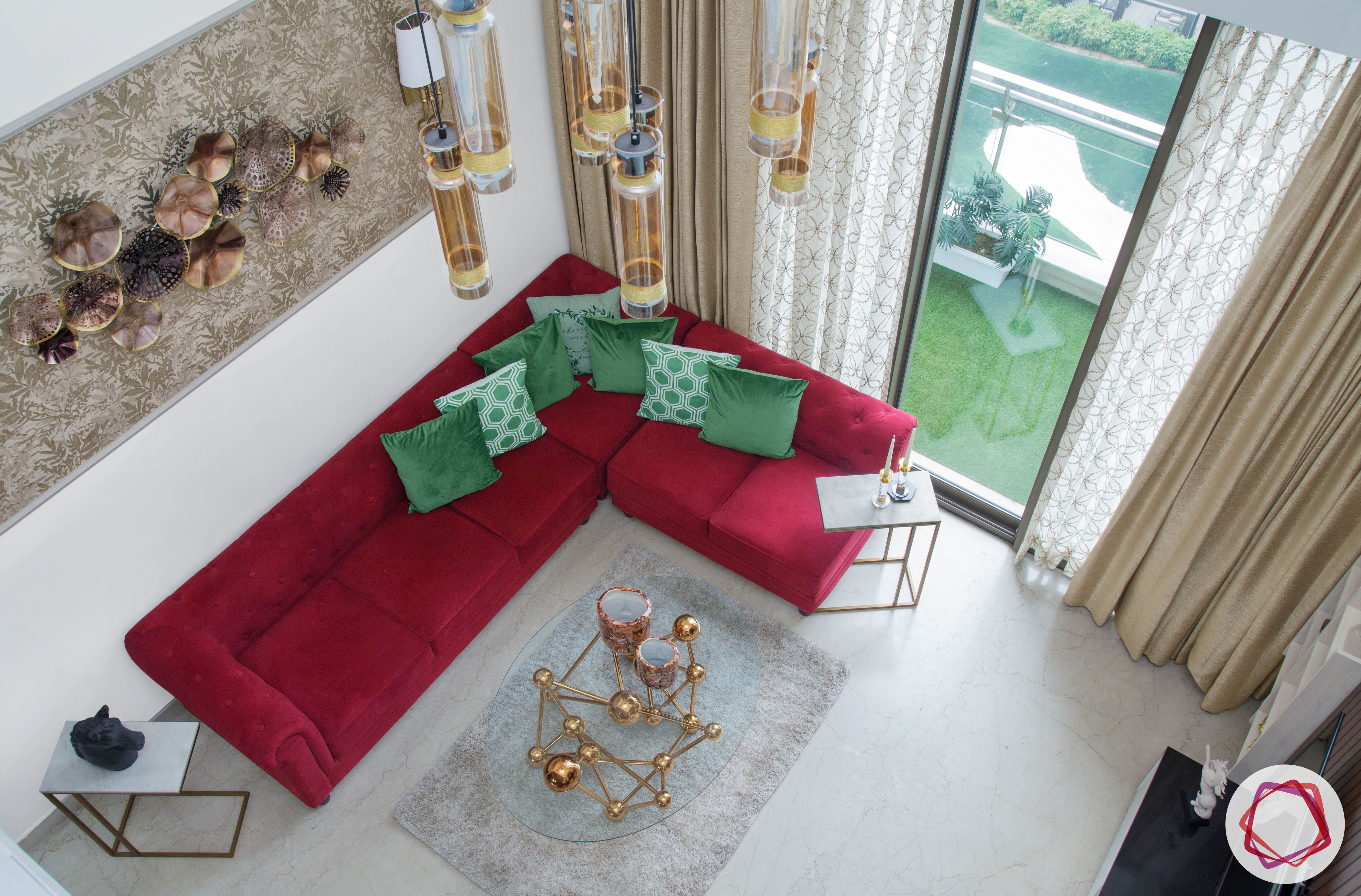 basic vastu for home-aerial view of room-living room-red sofa-chandelier-centre table
