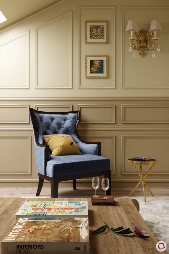 celebrity-homes-accent-blue-chair-trims-wall-table-wood-glasses-magazines