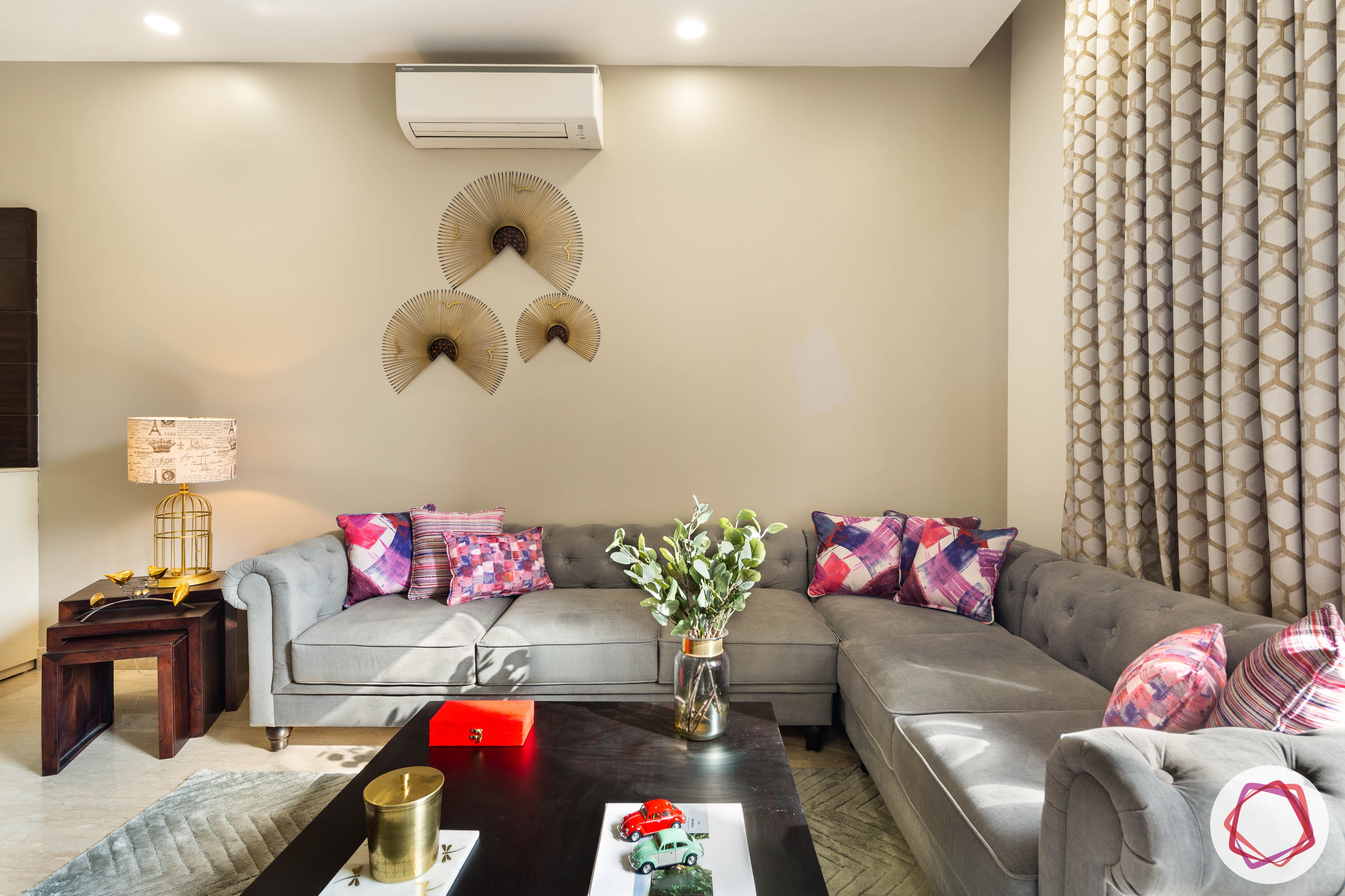 DLF garden villas-living-room-grey-l-shaped-sofa-table-pillows