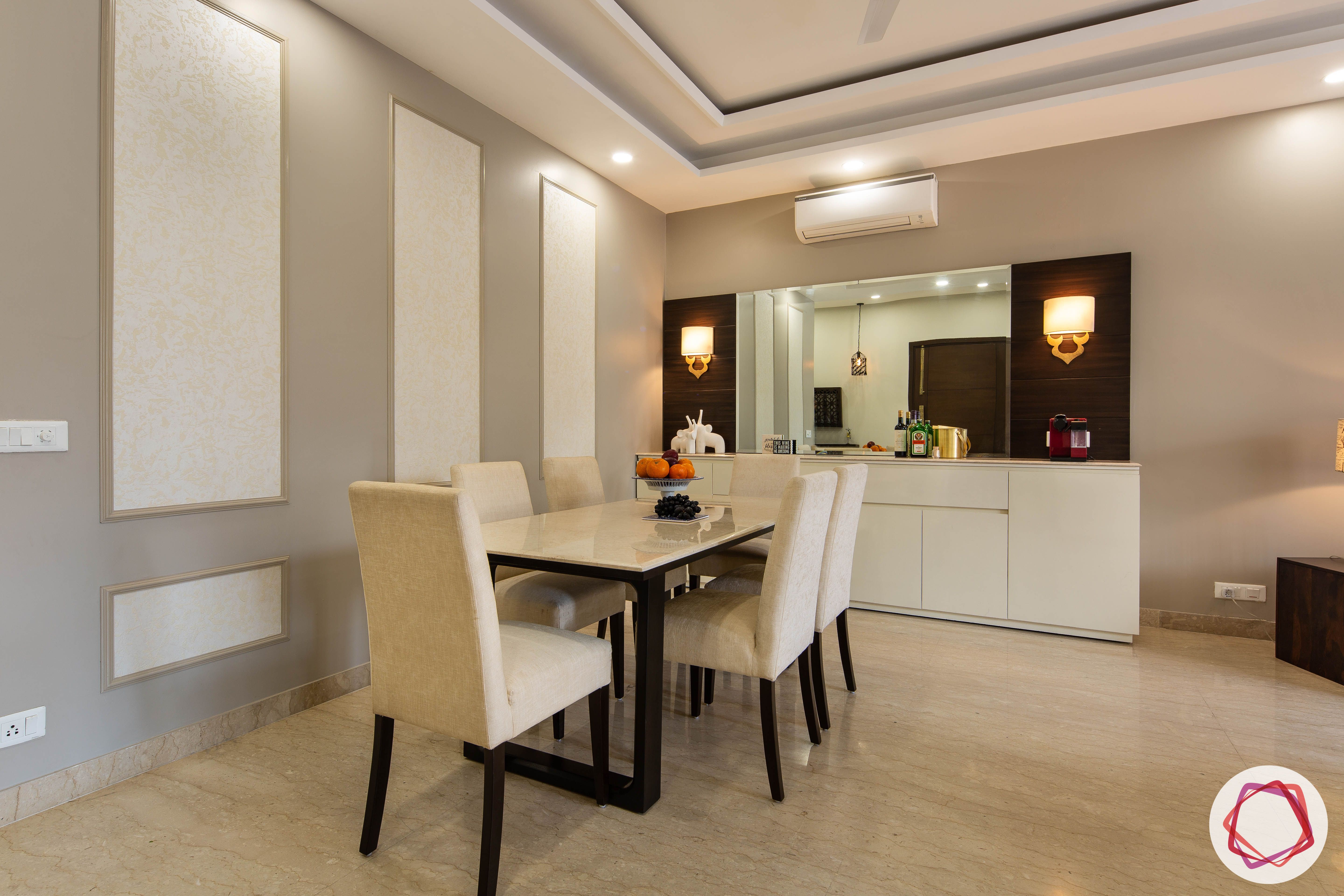 DLF garden villas-dining-room-marble-table-suede-chairs-wallpaper