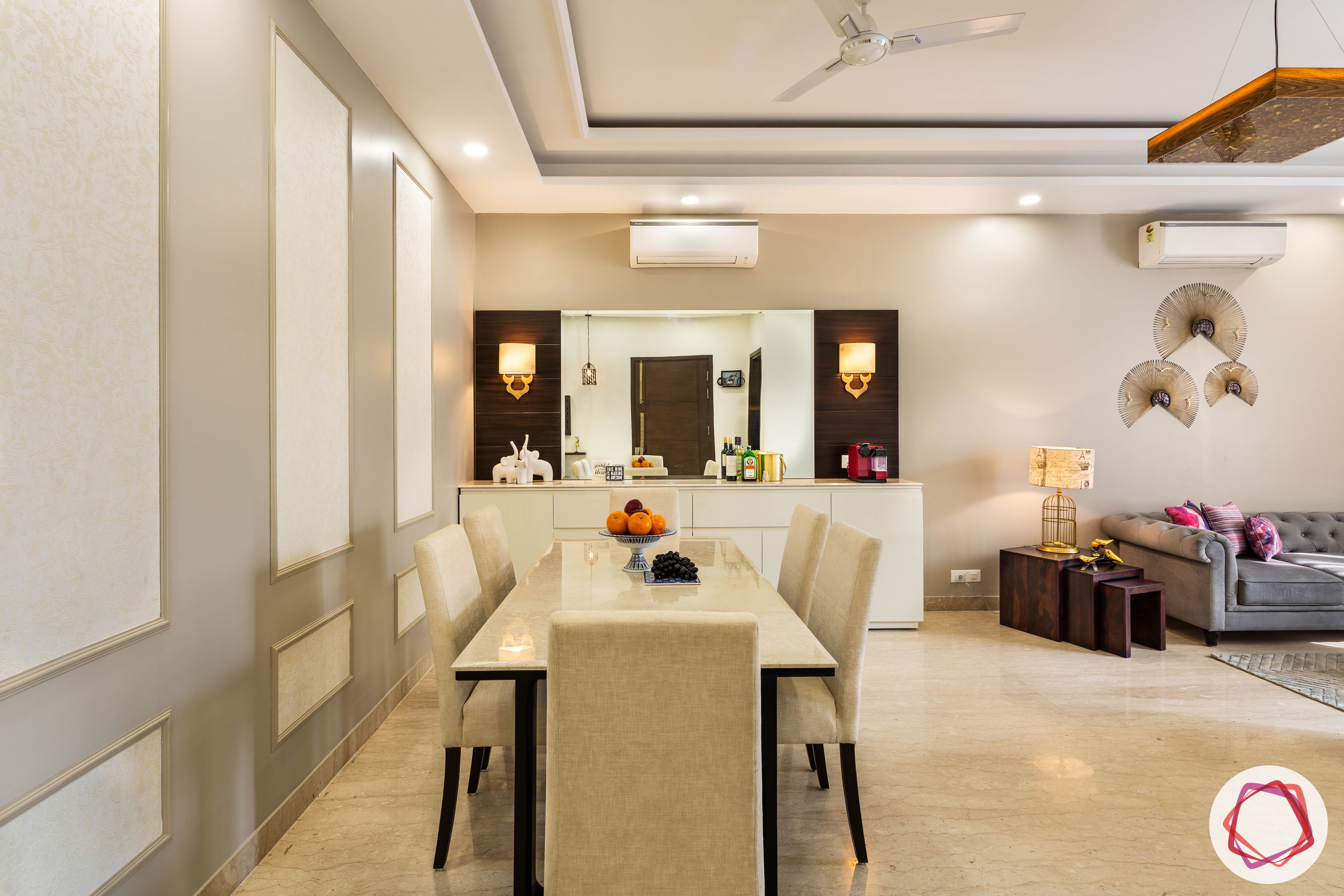 DLF garden villas-dining-room-marble-table-suede-chairs-crockery-cabinet