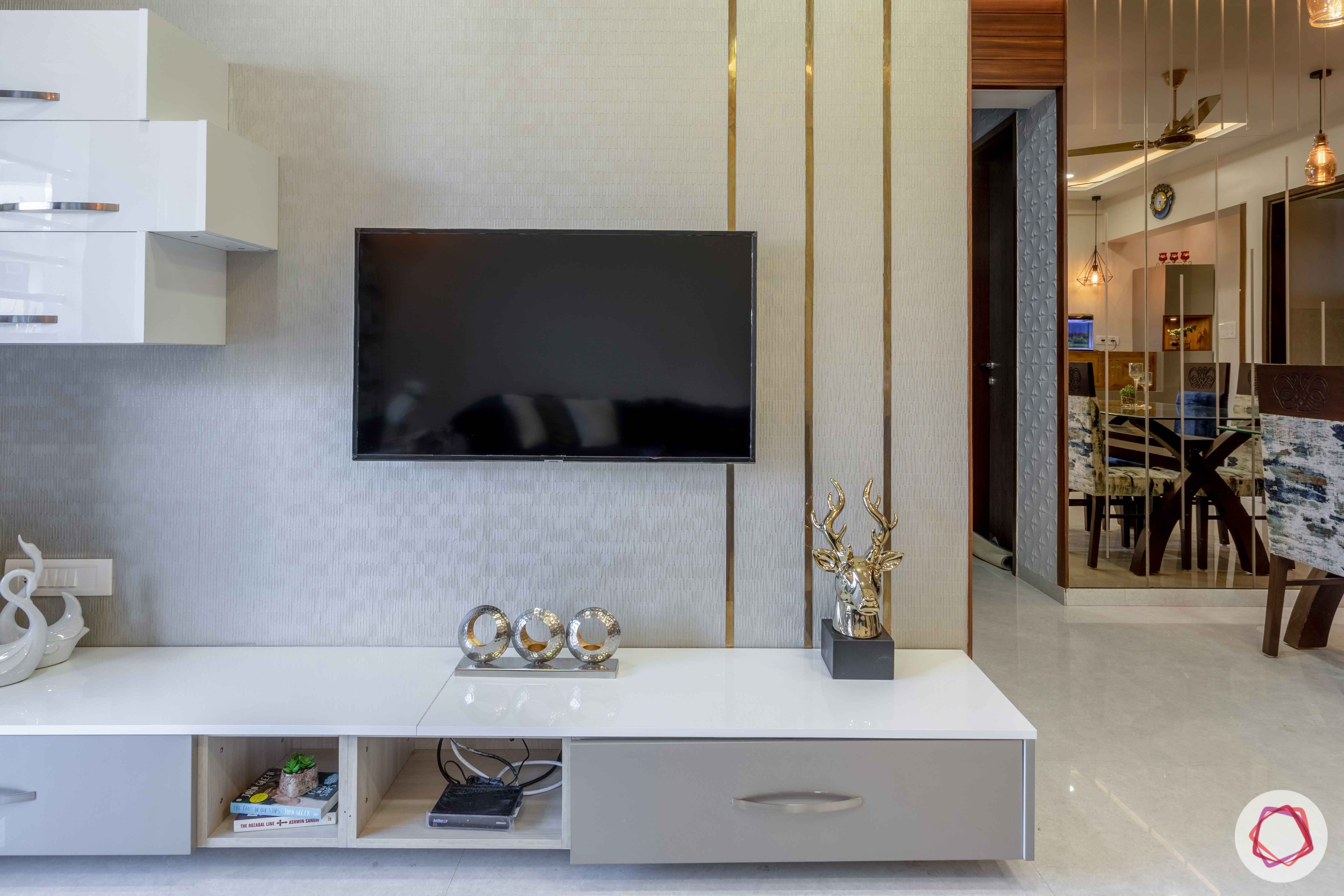 2 bhk flat interior-living room-tv unit-texture wallpaper-acrylic finish cabinets