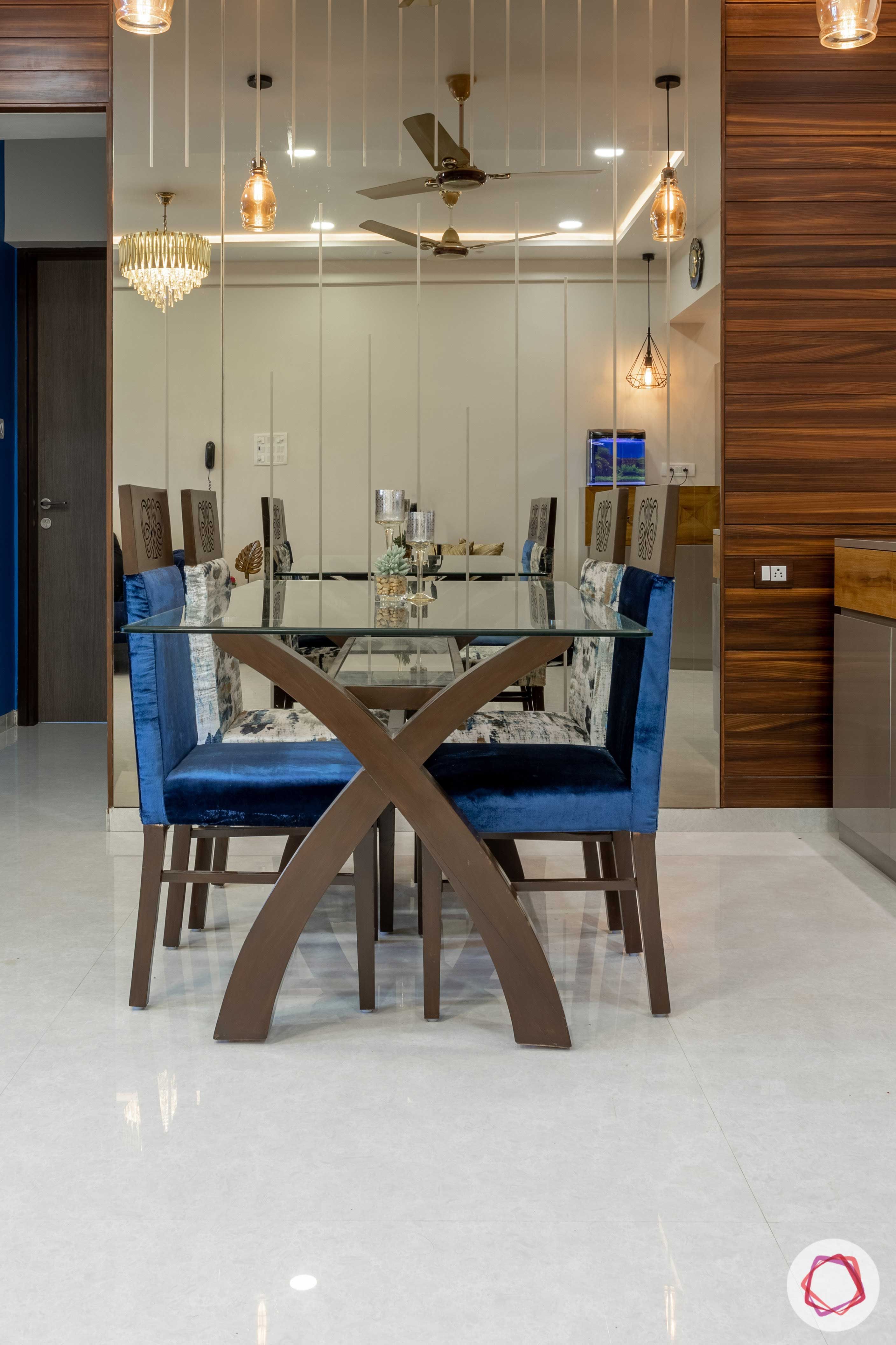 2 bhk flat interior-dining room-mirror panels-glass top table-upholstered chairs