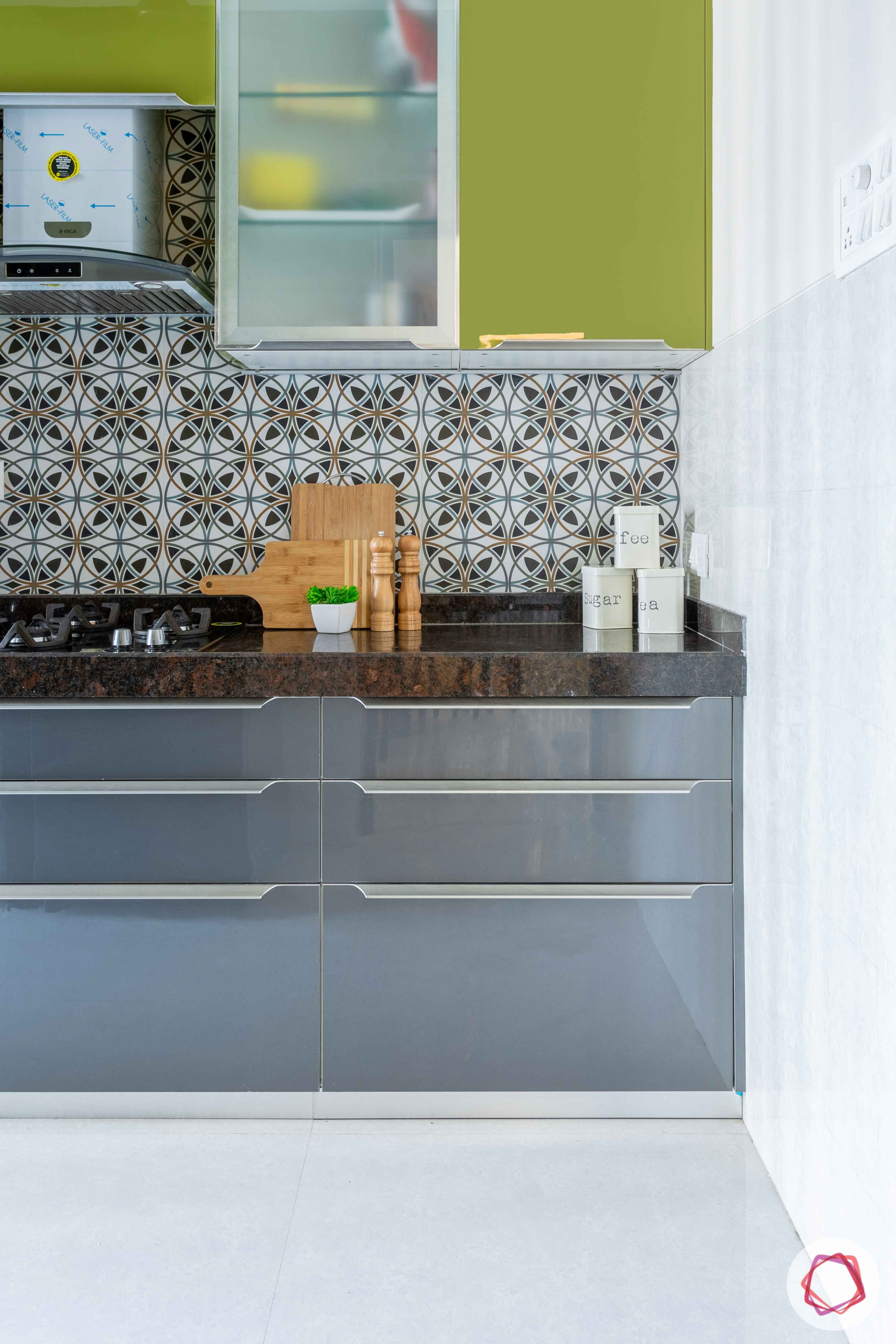 2 bhk flat interior-kitchen-green cabinets-glossy acrylic finish-grey base units-moroccan tiles