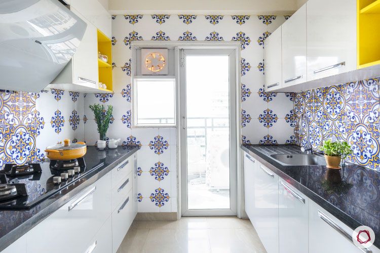 membrane-vs-laminate-white-cabinets-kitchen-patterned-backsplash-walls