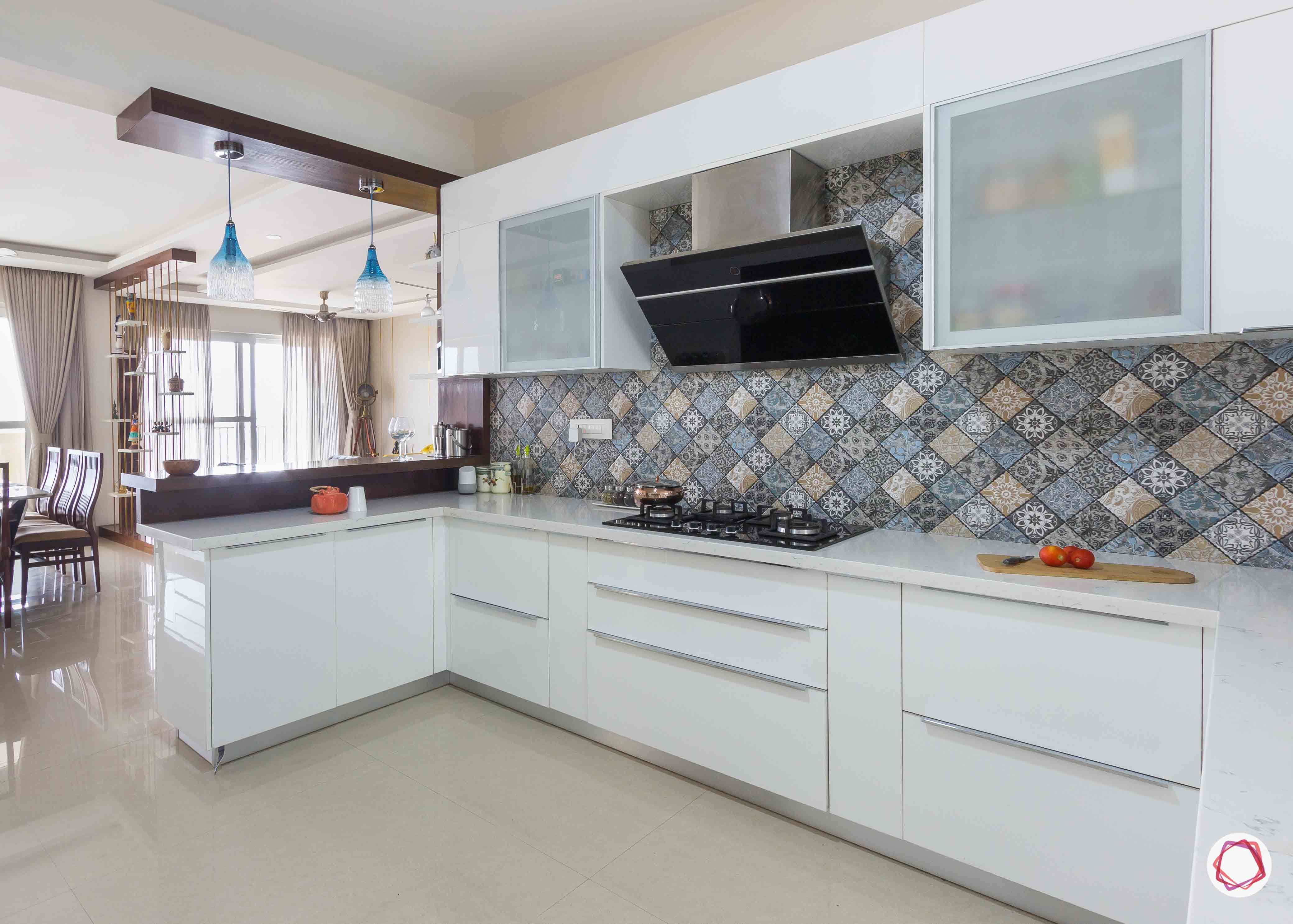 membrane-vs-laminate-white-glass-cabinets-stove-lights-breakfast-table