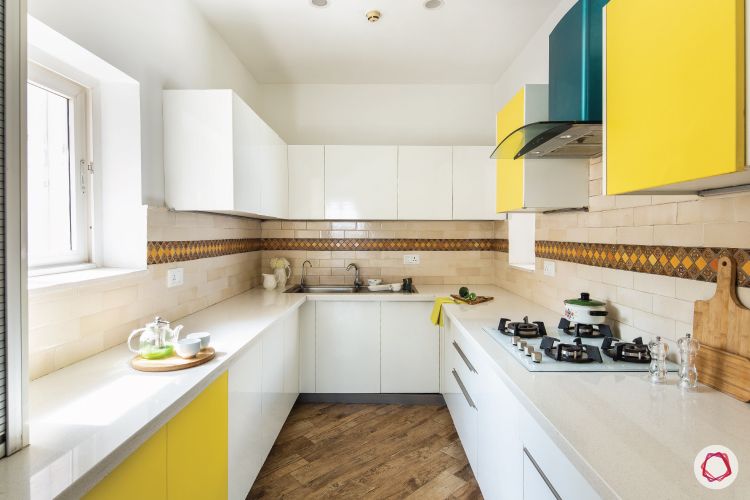 membrane-vs-laminate-white-upper-yellow-lower-cabinets-brown-tiles-kitchen