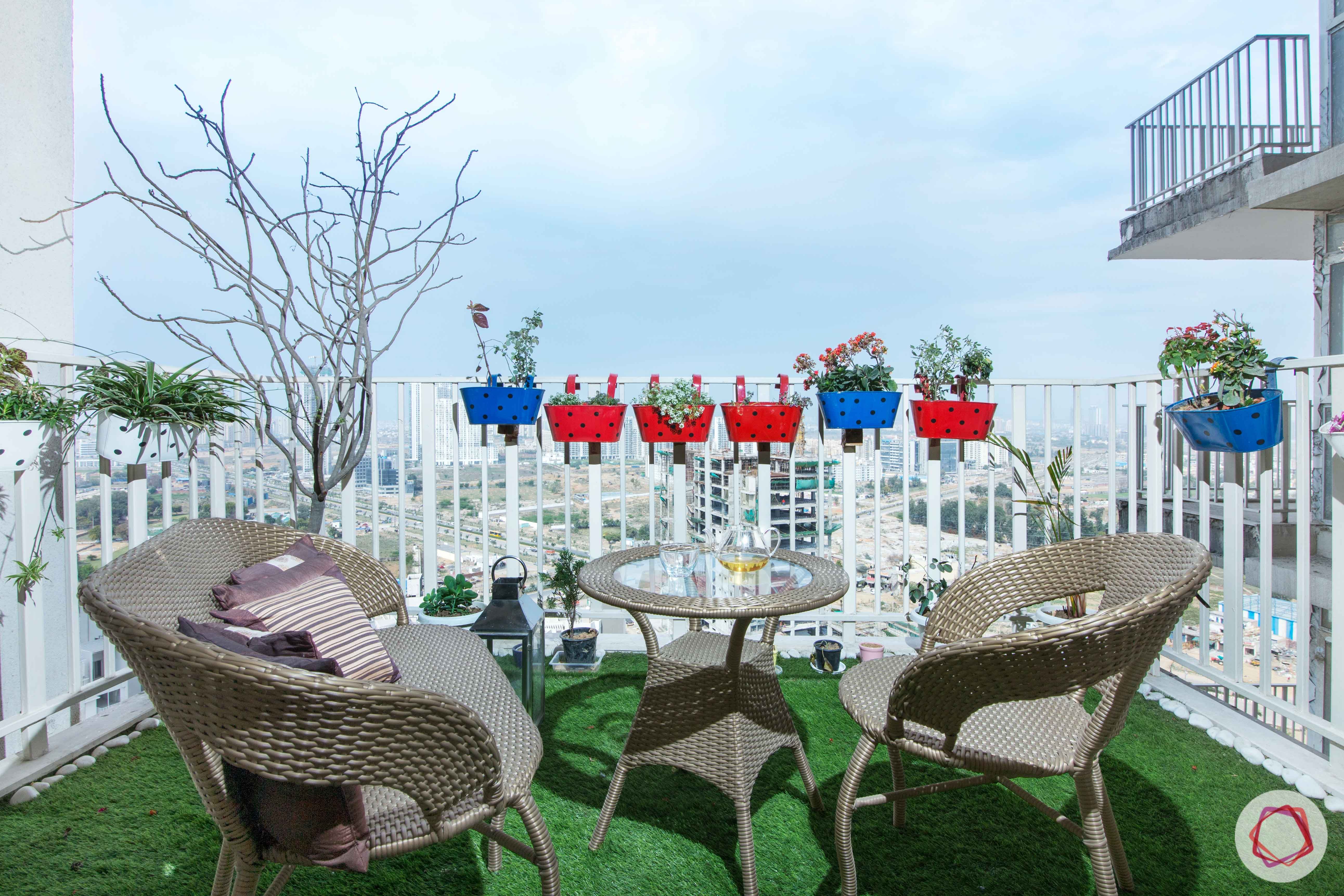 balcony-colourful planters-balcony seating-grass carpet-artificial turf
