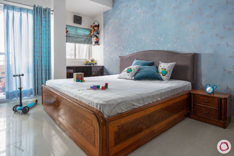 sunworld-vanalika-guest-bedroom-blue-wallpaper-wooden-bed-study-corner