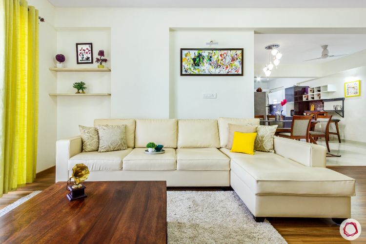 top-interior-designers-in-bangalore-living-room-beige-sofa-wooden-table