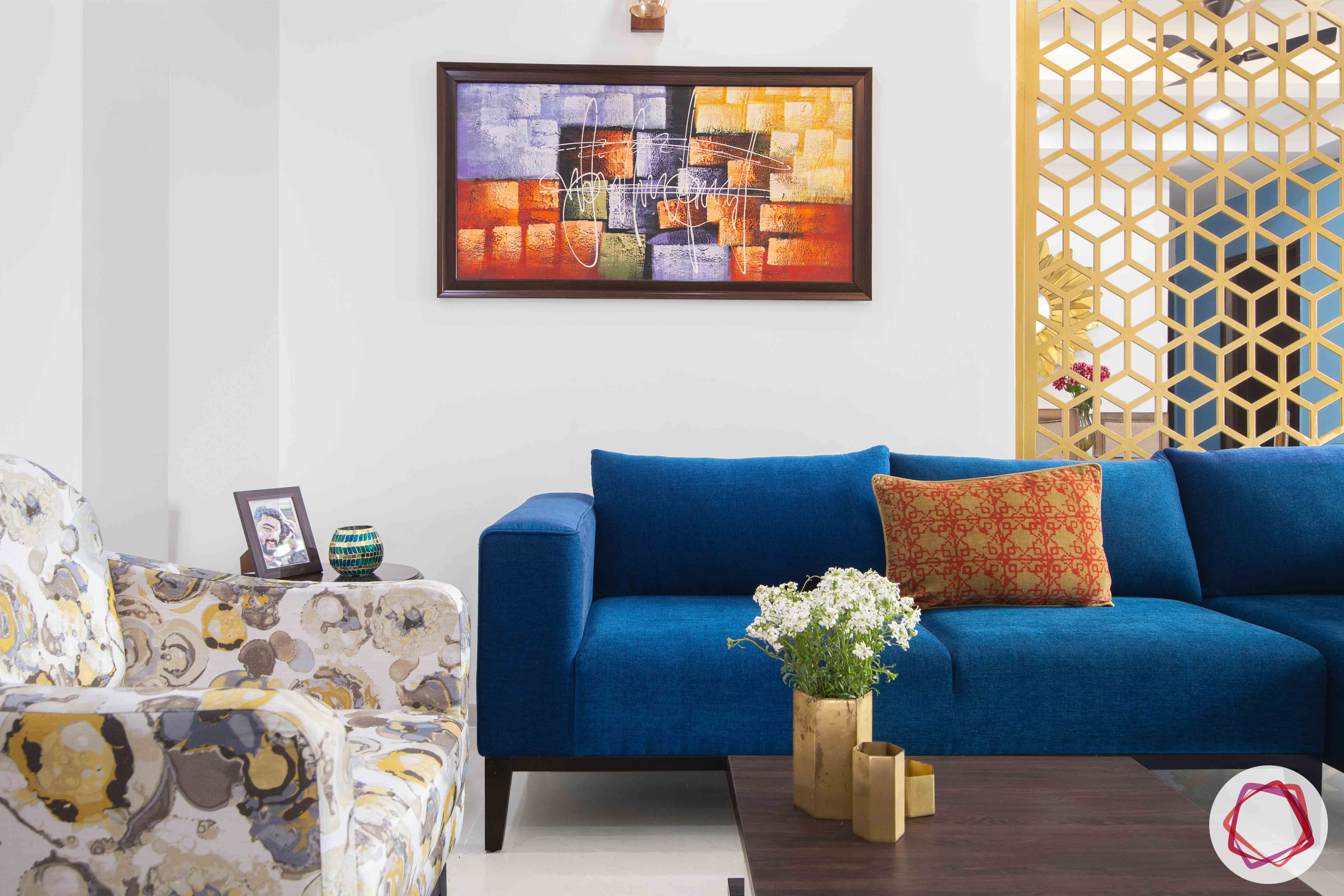 3bhk flat interior design-blue sofa design-metallic jaali partition designs