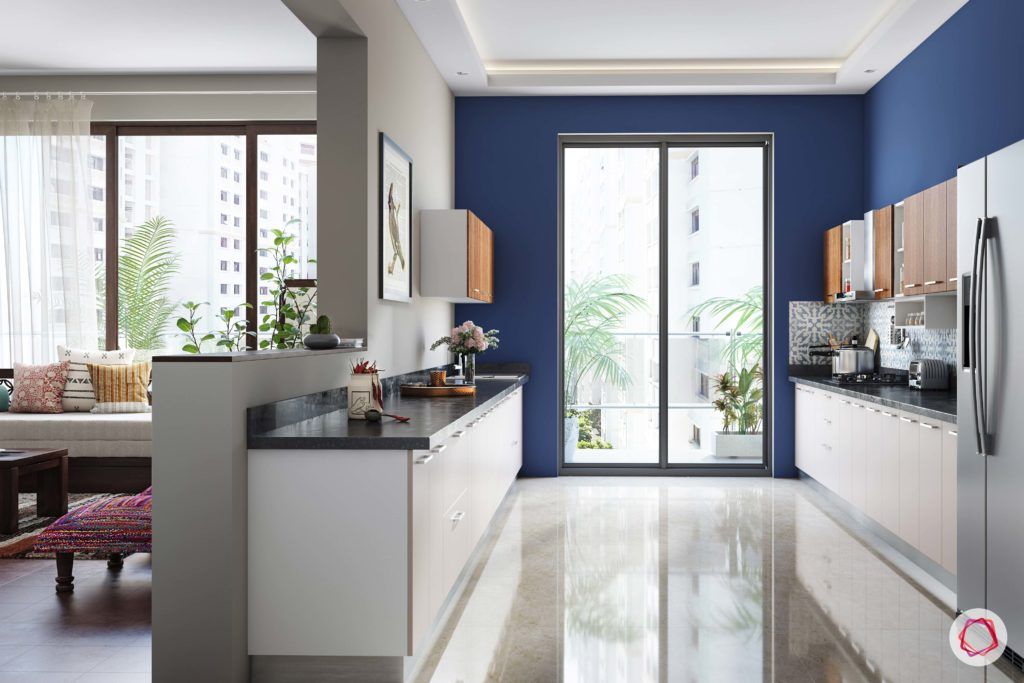 radhika apte_open kitchen-blue walls_natural light