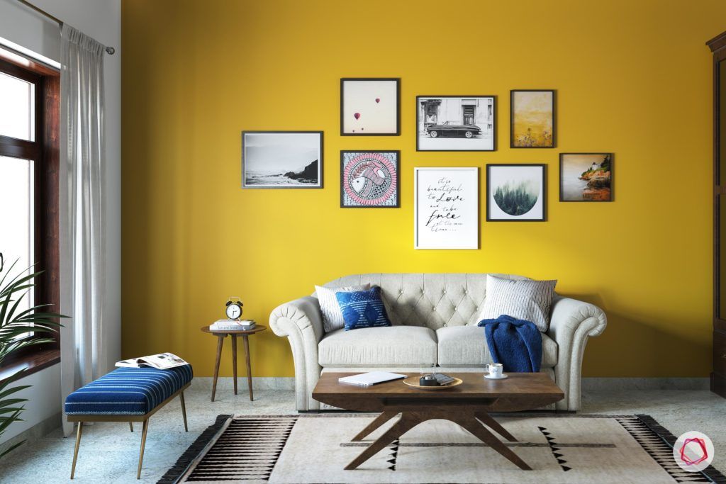 radhika apte-spare-room-curtains-bench-coffee-table-sofa-rug-yellow-wall