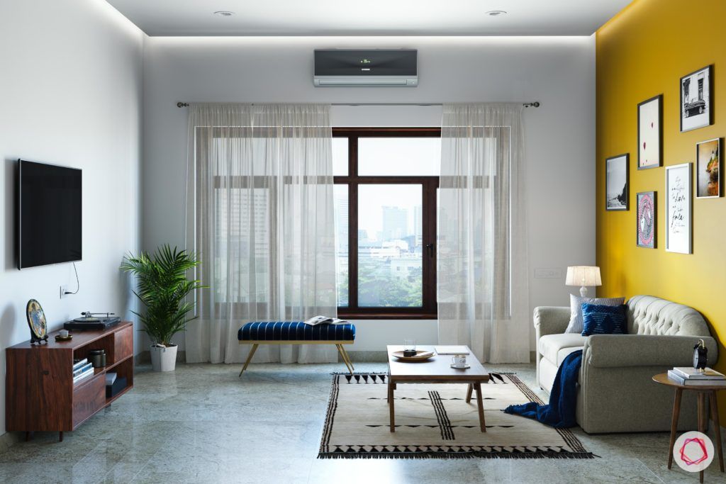 radhika apte-spare-room-TV-curtains-bench-coffee-table-sofa-rug