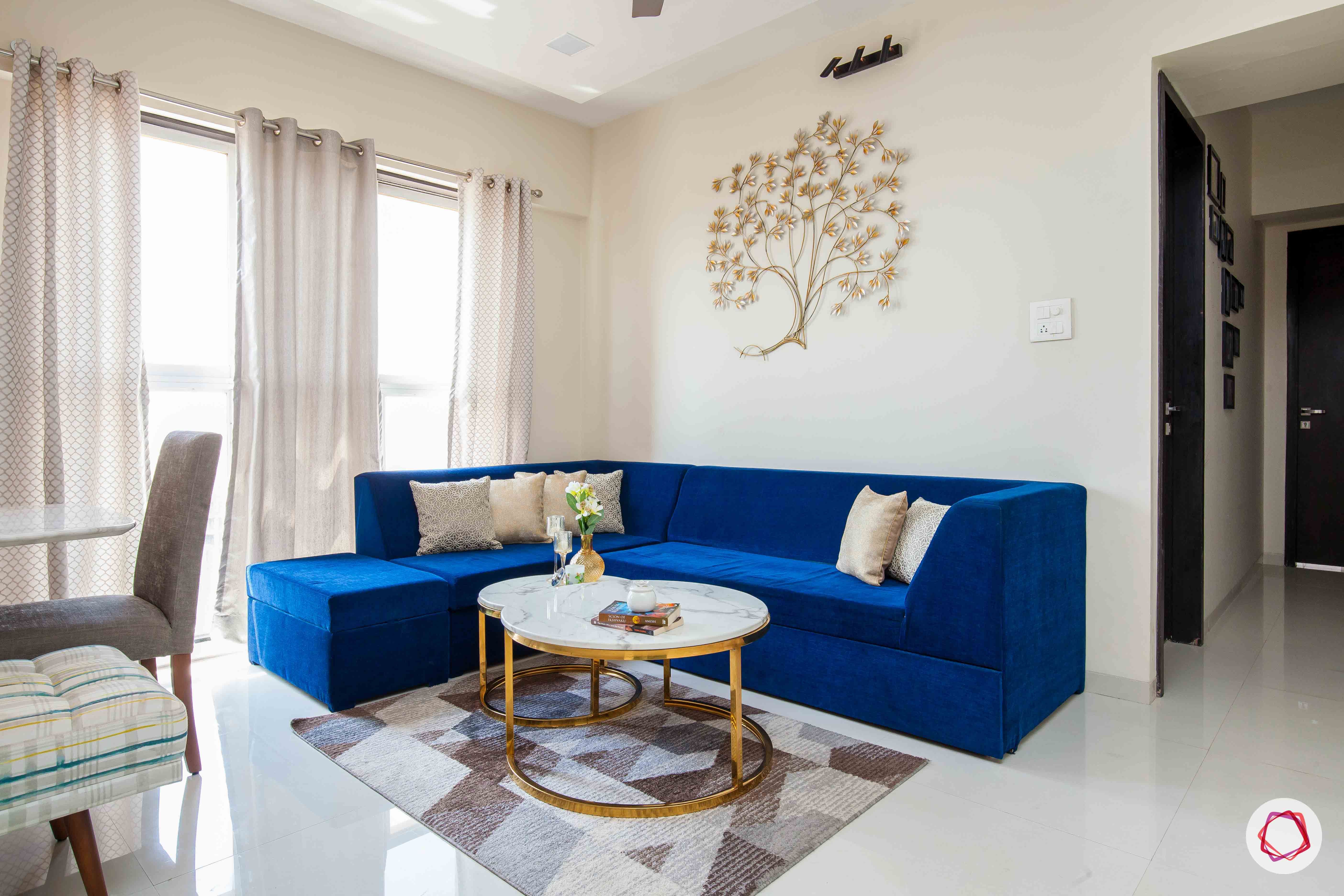 akshar elementa-living room-blue sofa-centre table-wall decor