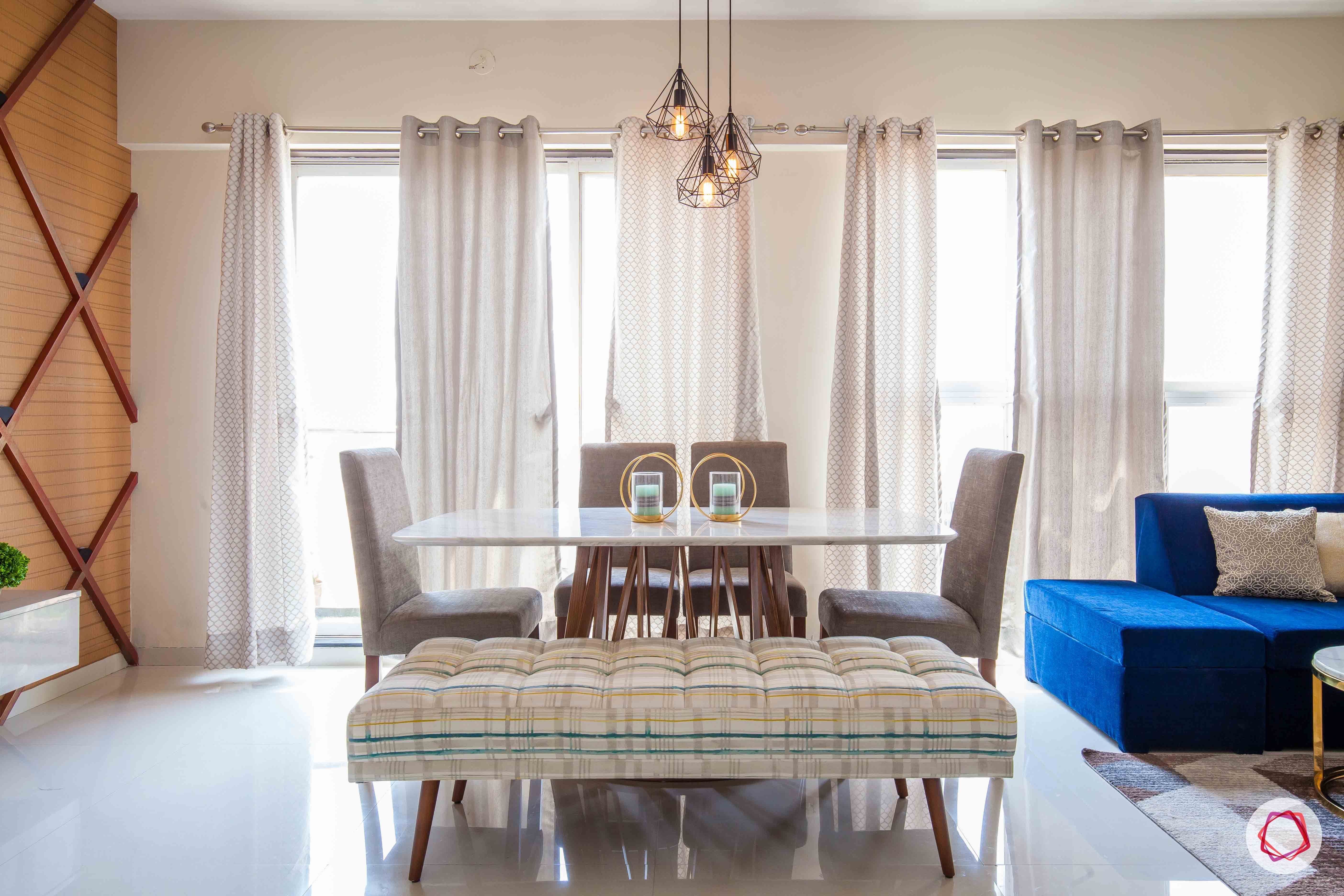 akshar elementa-dining room-white curtains-bench-upholstered chairs