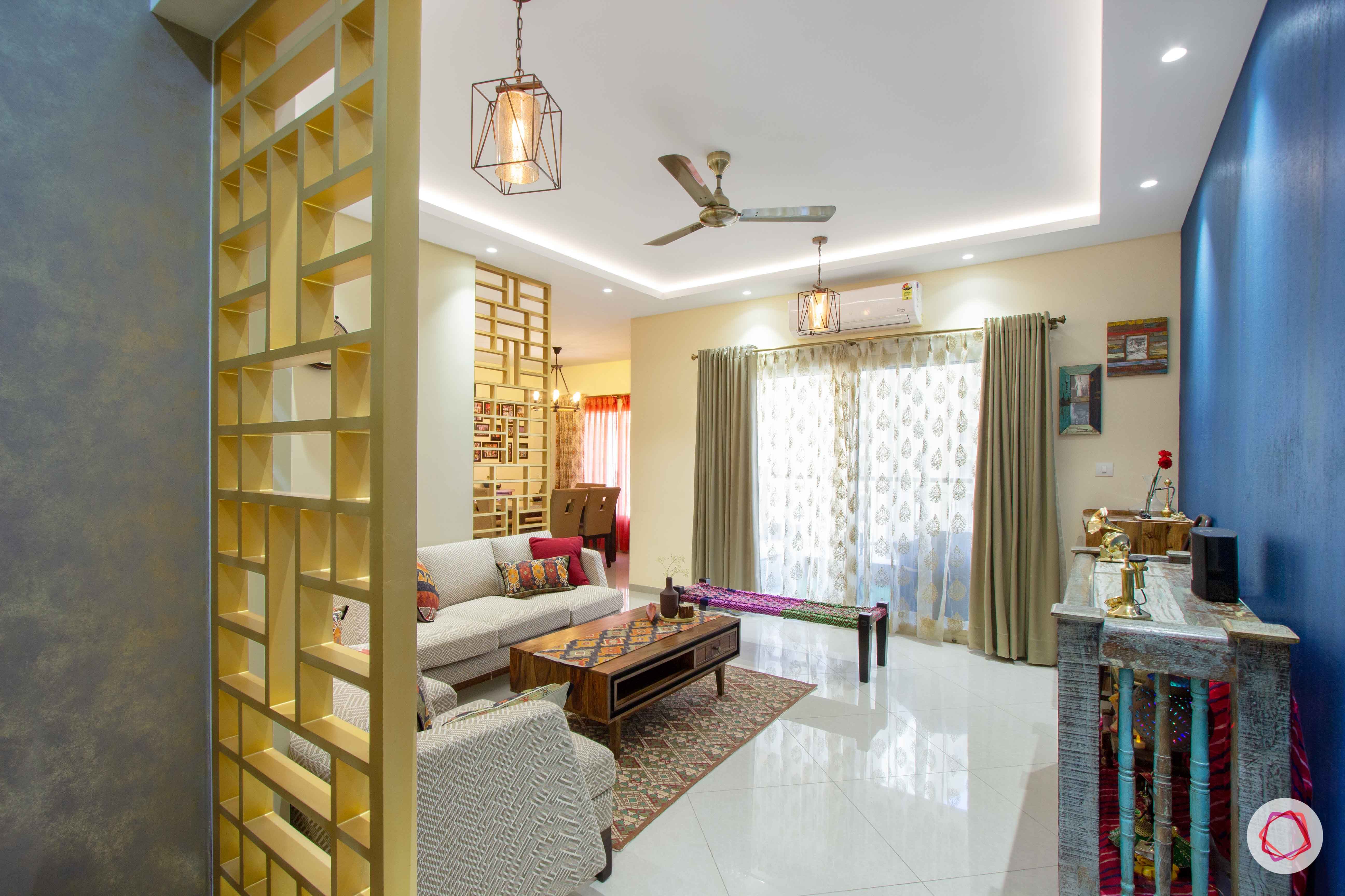 contemporary-house-design-foyer-gold-jali-wallpaper-blue-false-ceiling