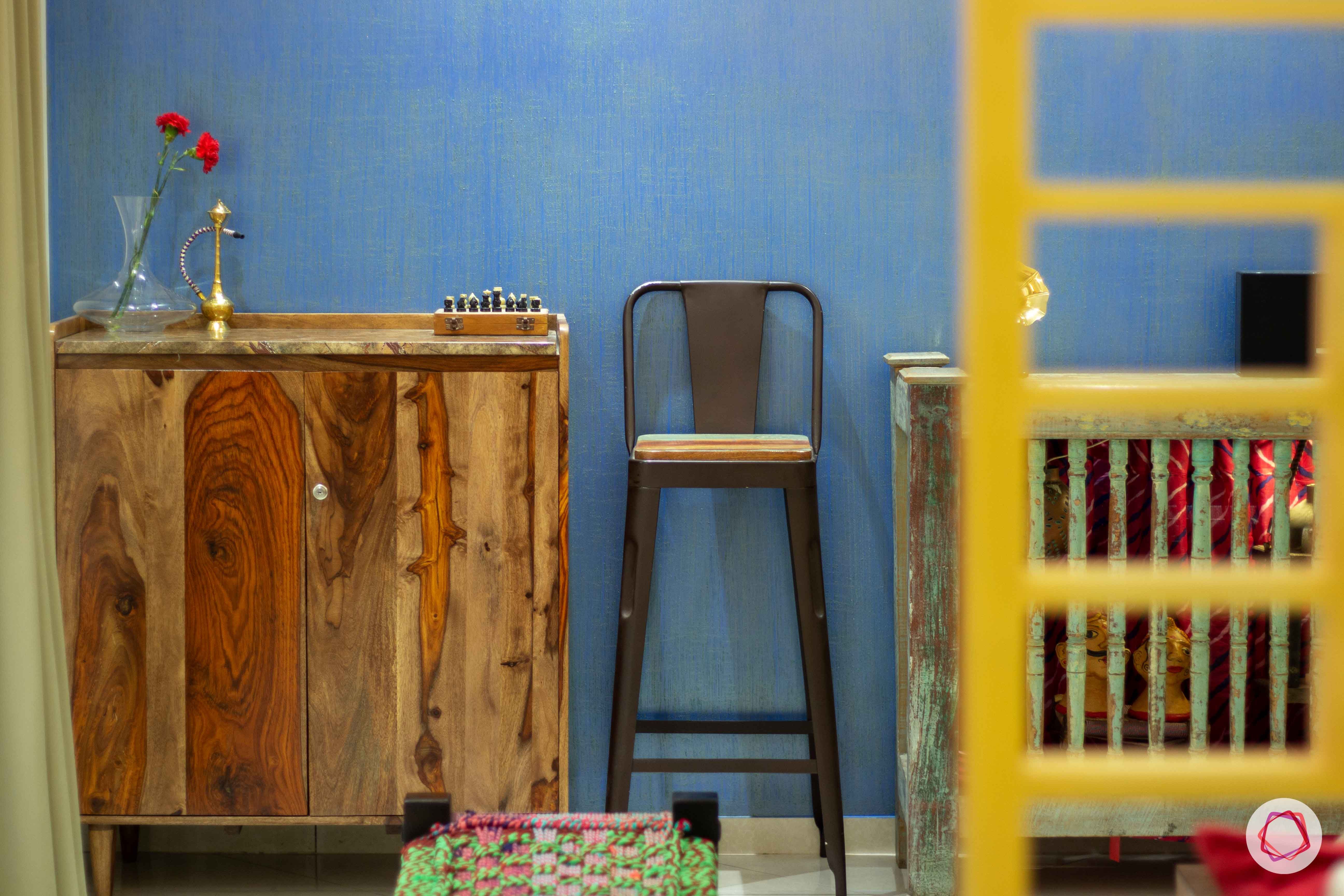 contemporary-house-design-living-room-blue-wallpaper-distressed-console-bar-unit-stool